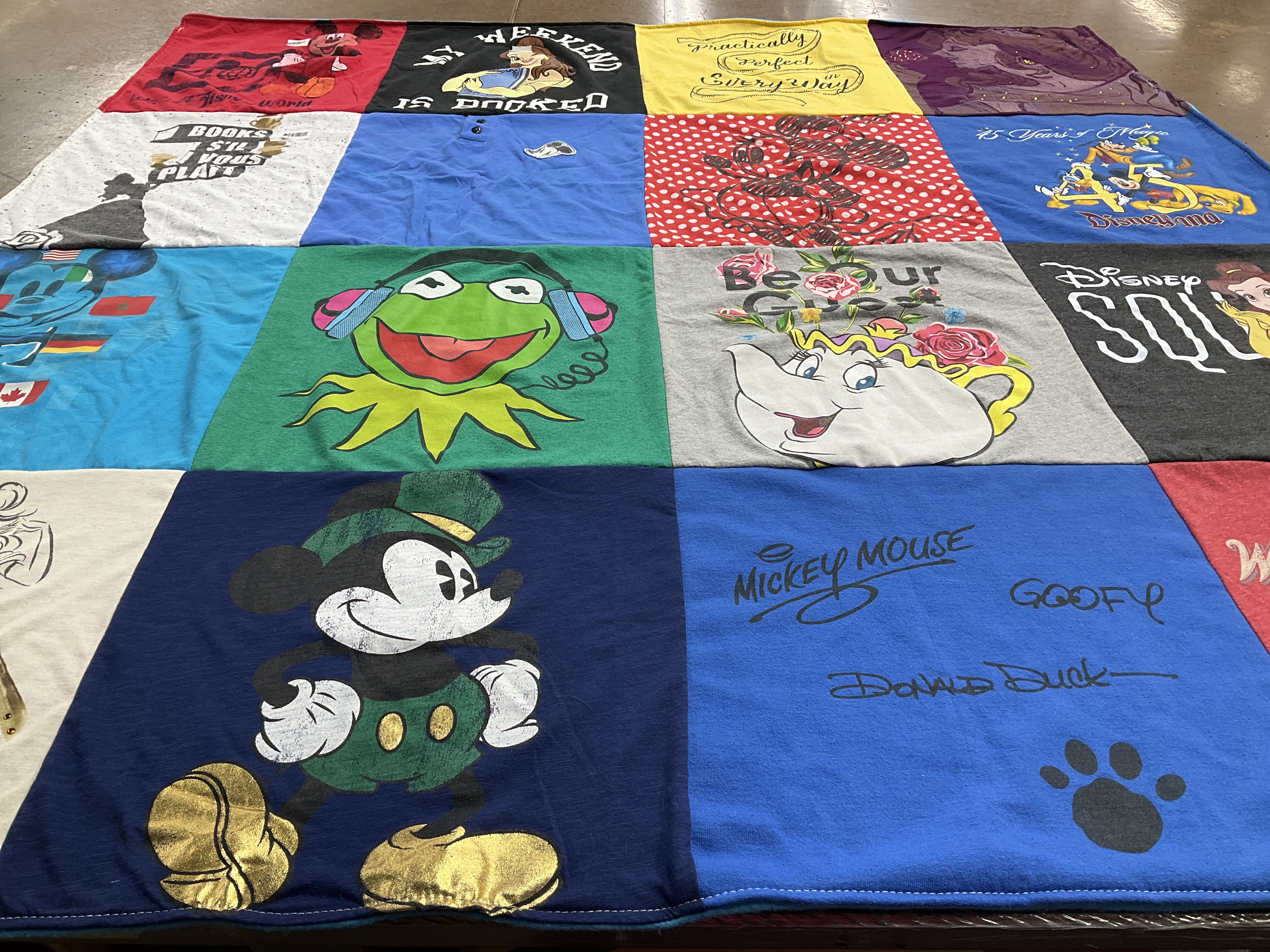 T-shirt quilt with disney, characters themes by Kathleen from IL