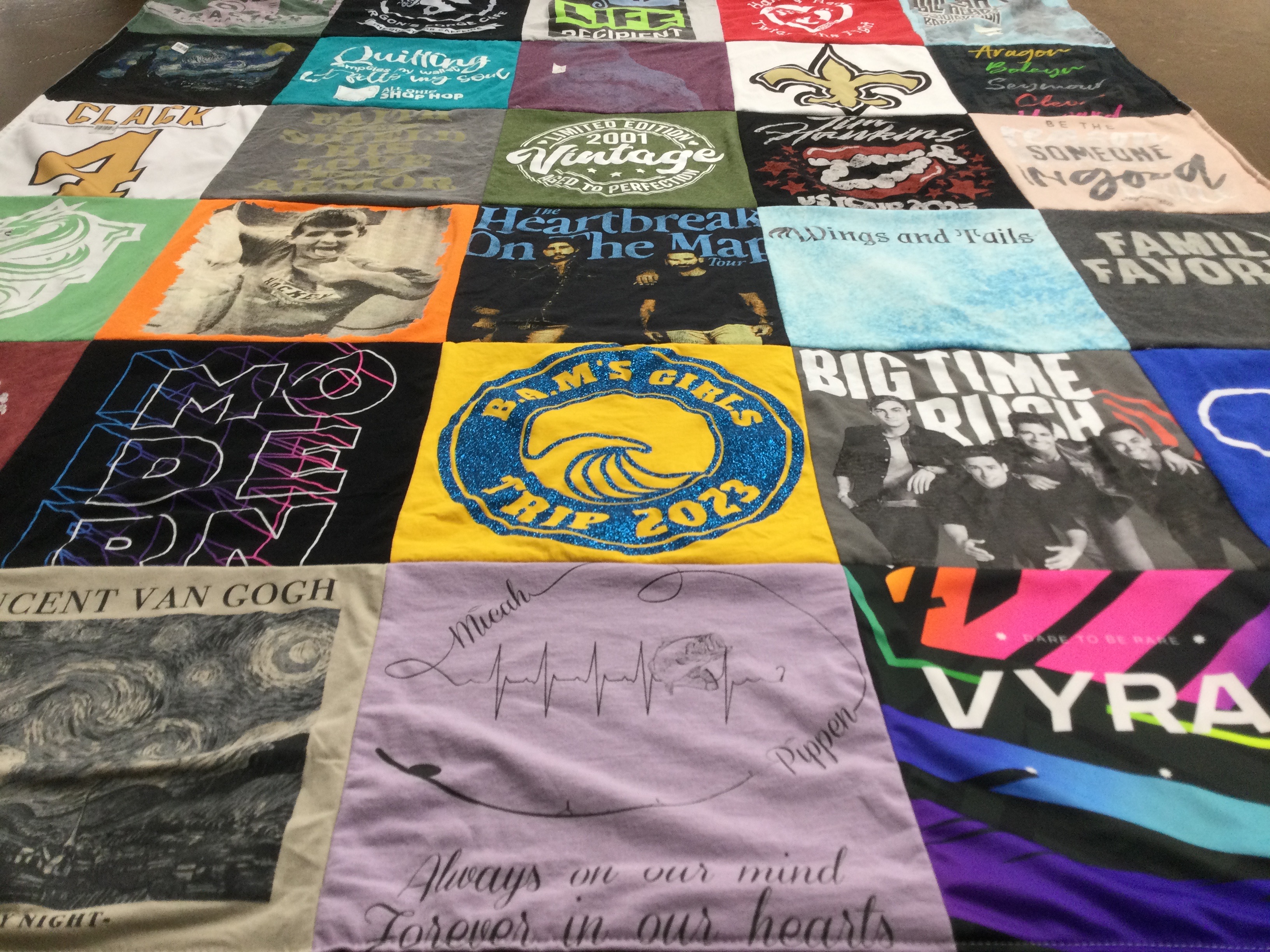 T-shirt quilt with art, music themes by Amy from OH