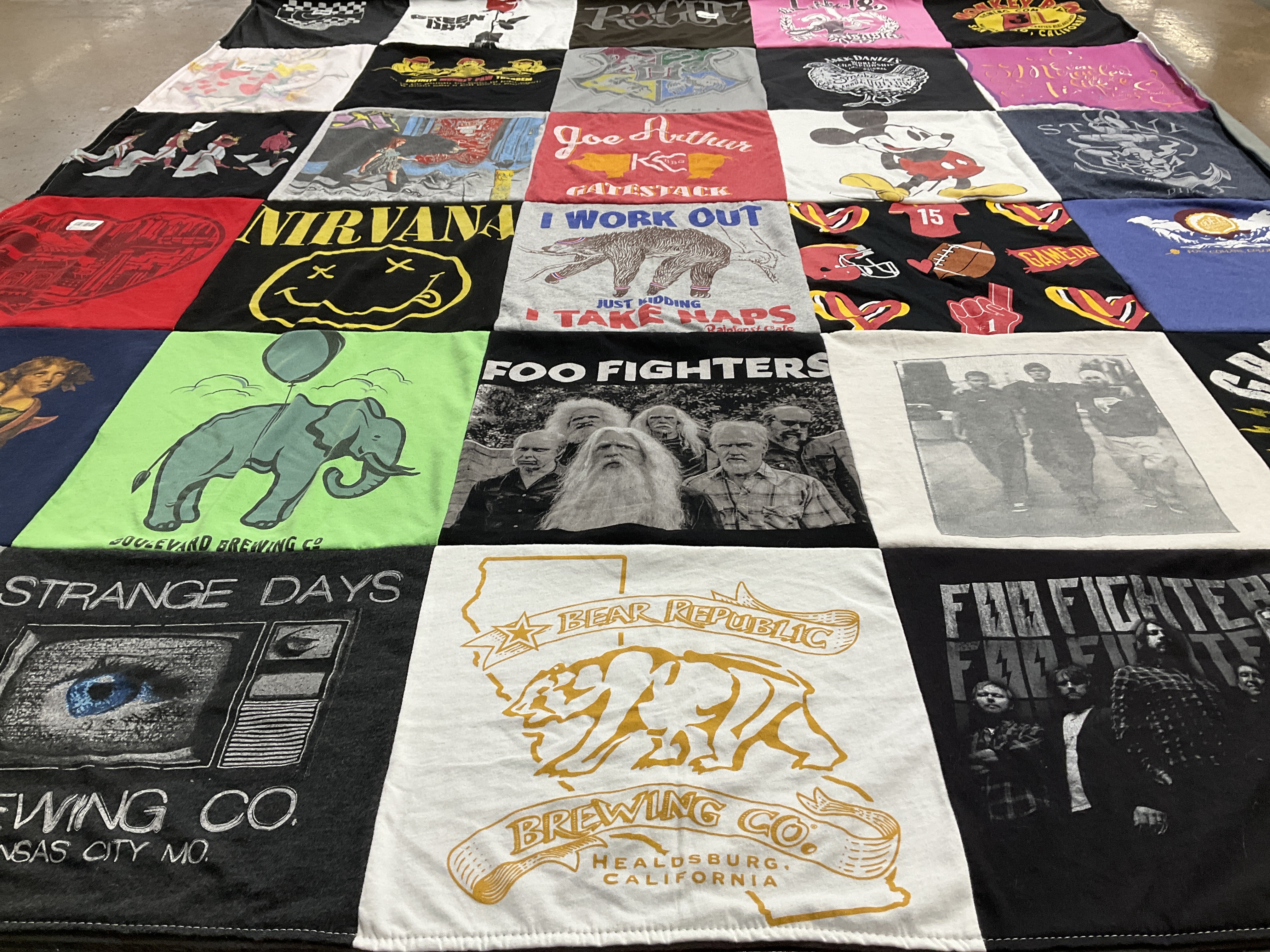 Custom Project Repat t-shirt quilt highlighting music, brewing themes.