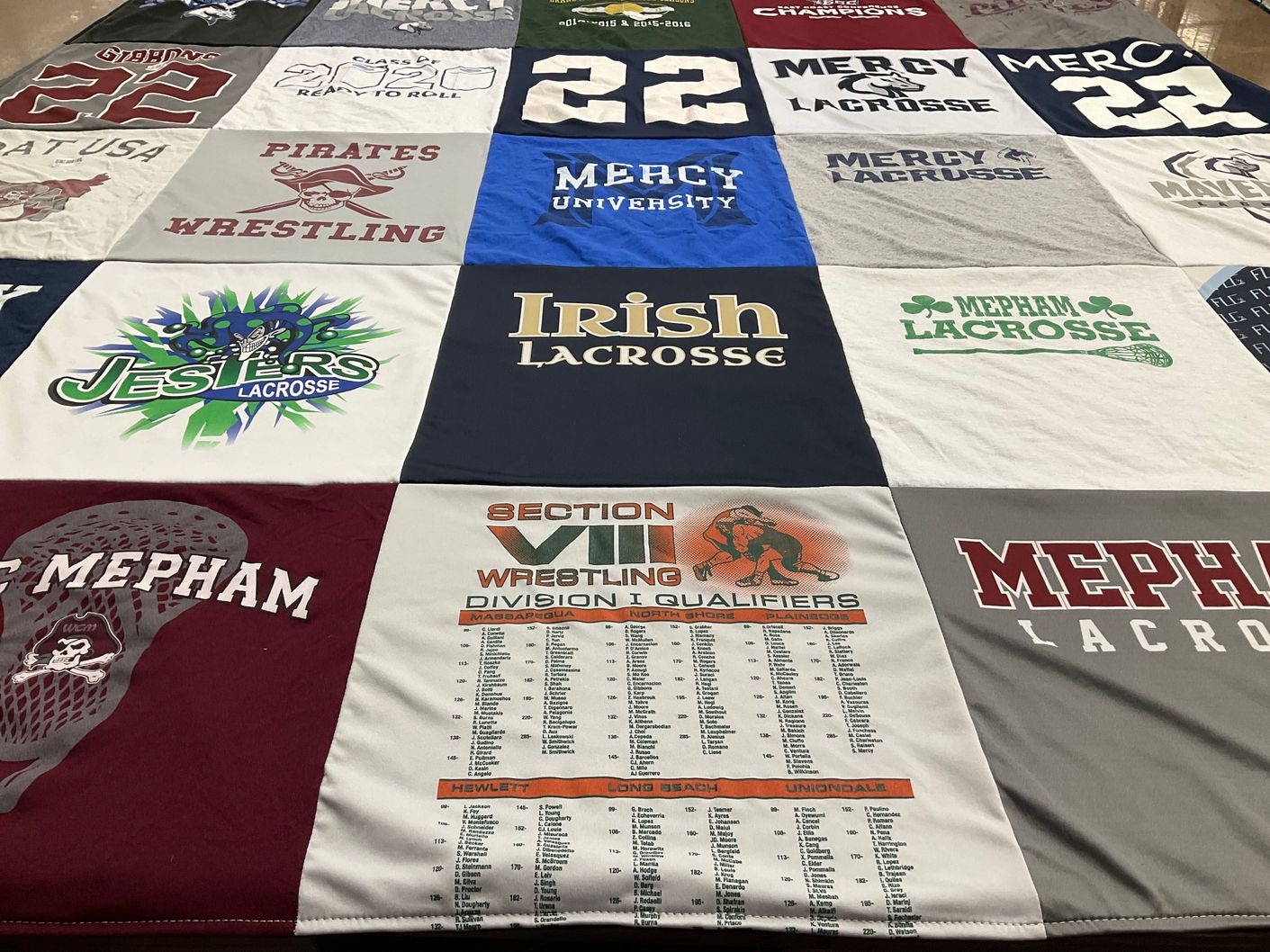 T-shirt quilt featuring pirates wrestling, jesters lacrosse by Beth from NY