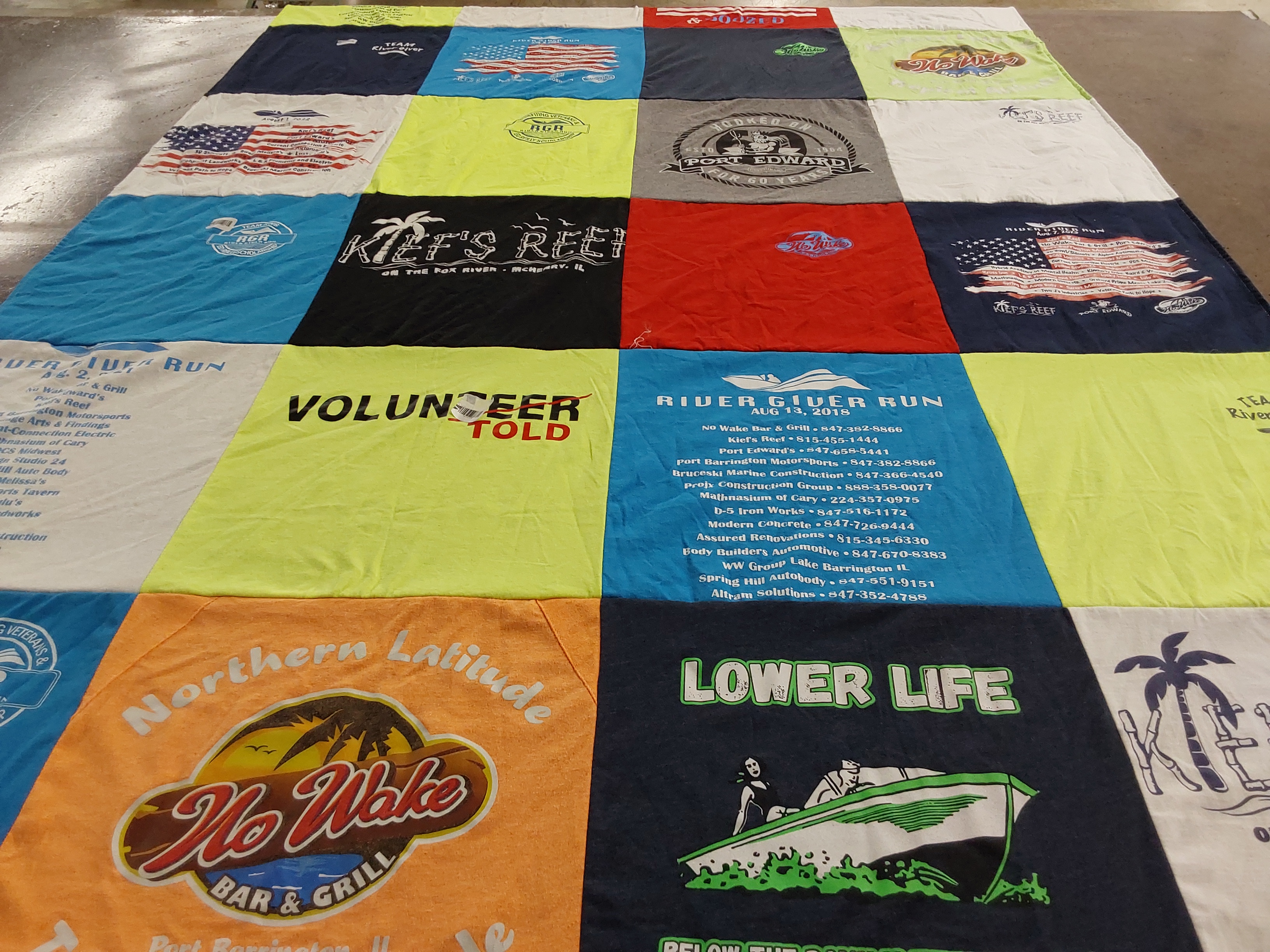 Custom Project Repat t-shirt quilt highlighting boating, river activities themes.