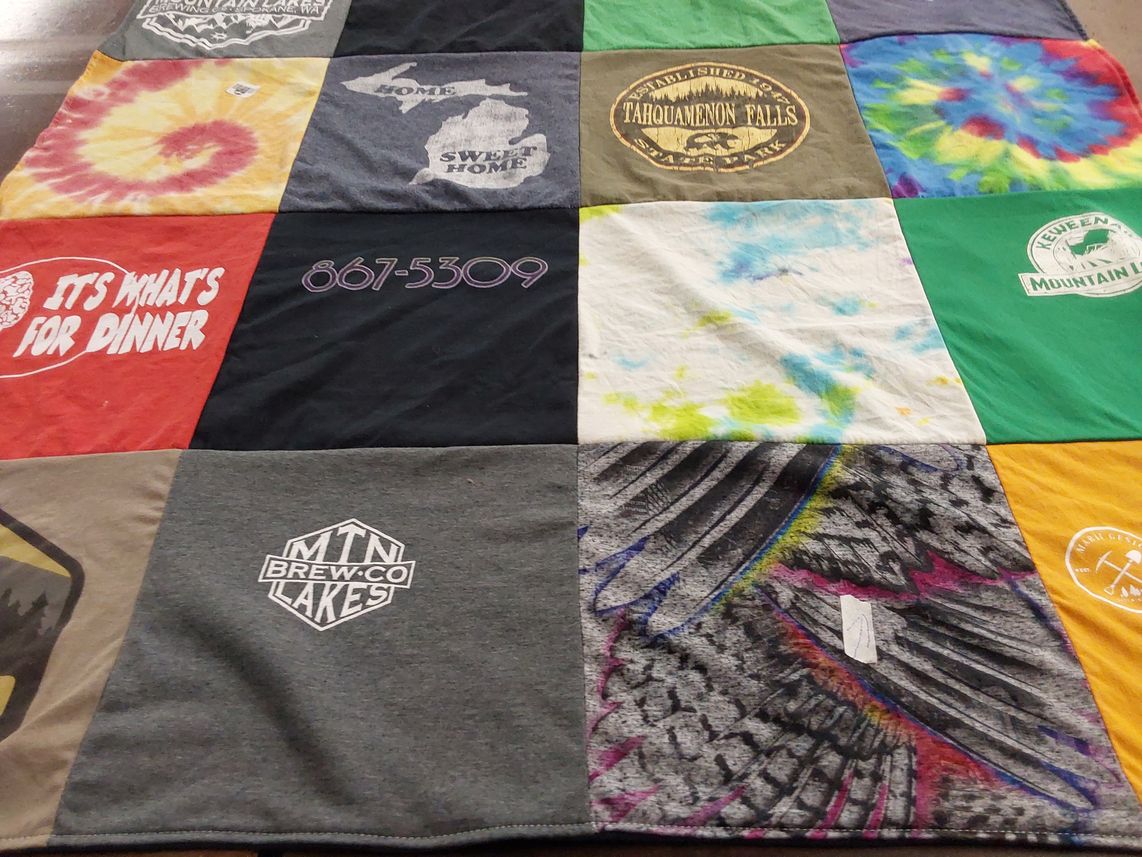 T-shirt quilt with outdoor activities, travel themes by Sandra from MI