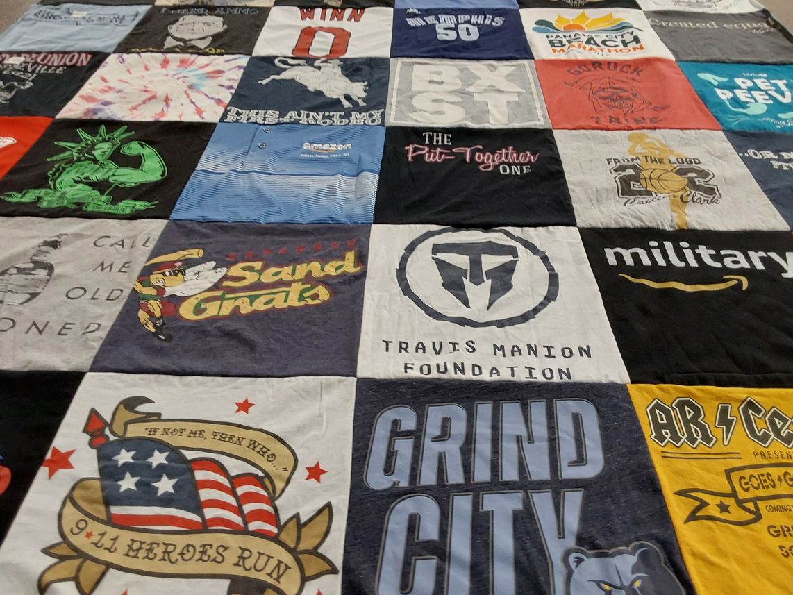 T-shirt quilt with sports, veteran support themes by Paul from TN