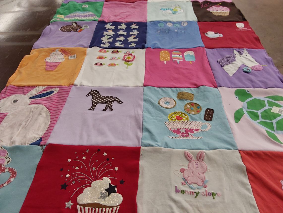 T-shirt quilt with pugs, animal rescue themes by Andrea from TX
