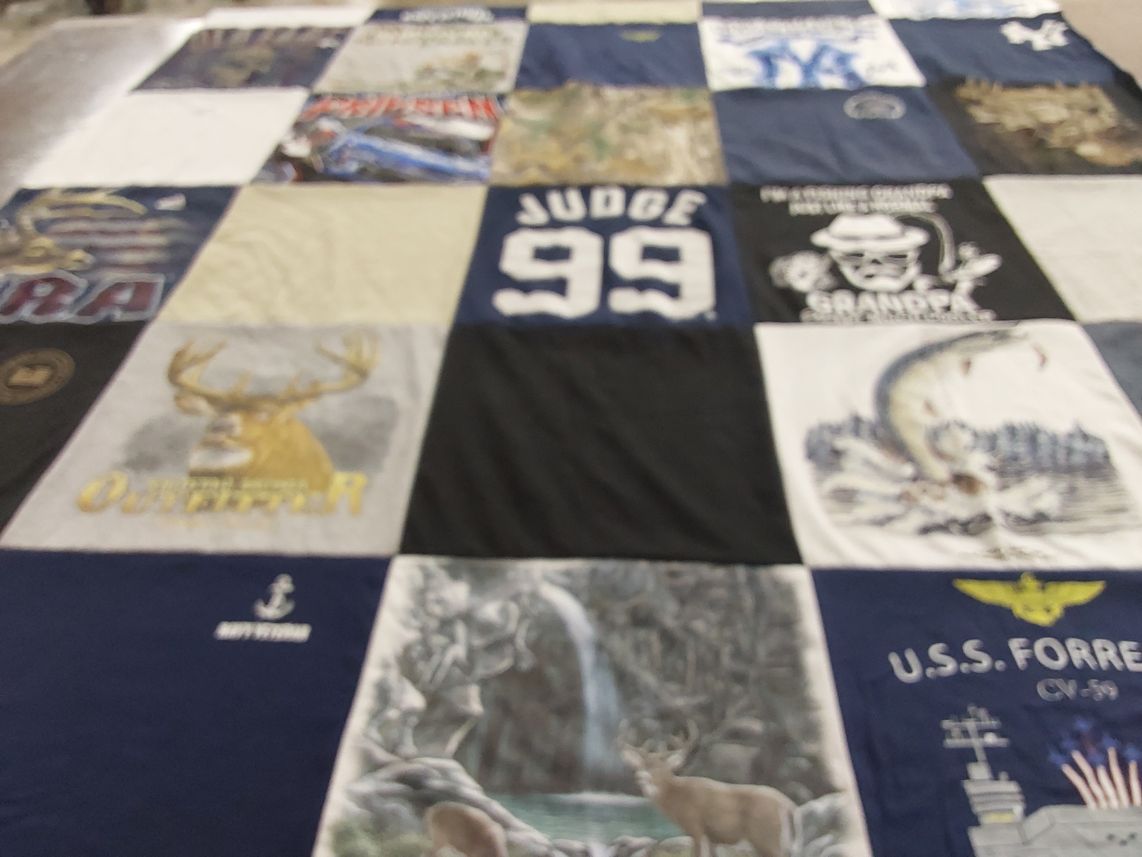 T-shirt quilt with hunting, fishing themes by Susan from NY