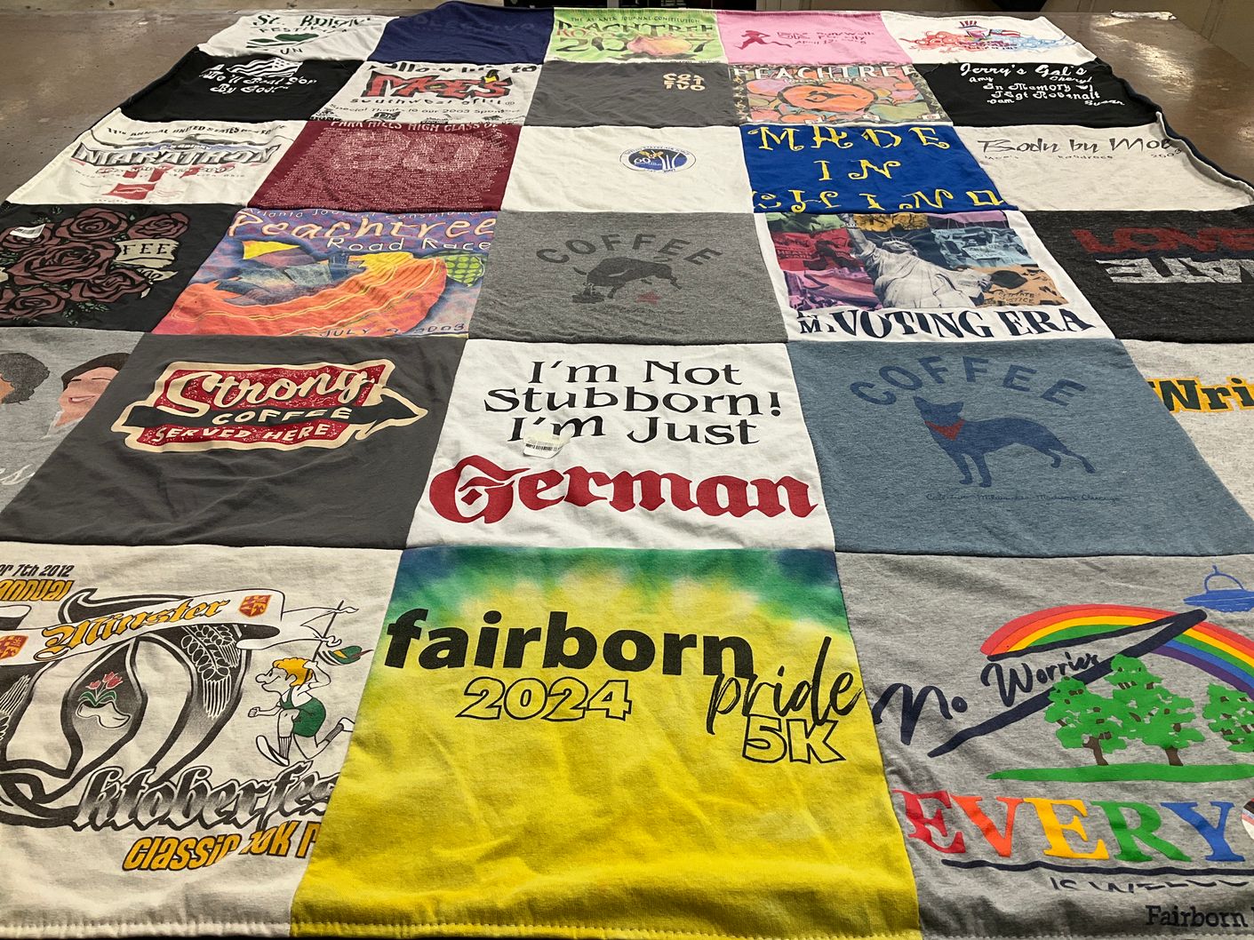 T-shirt quilt with coffee, running themes by Susan from OH