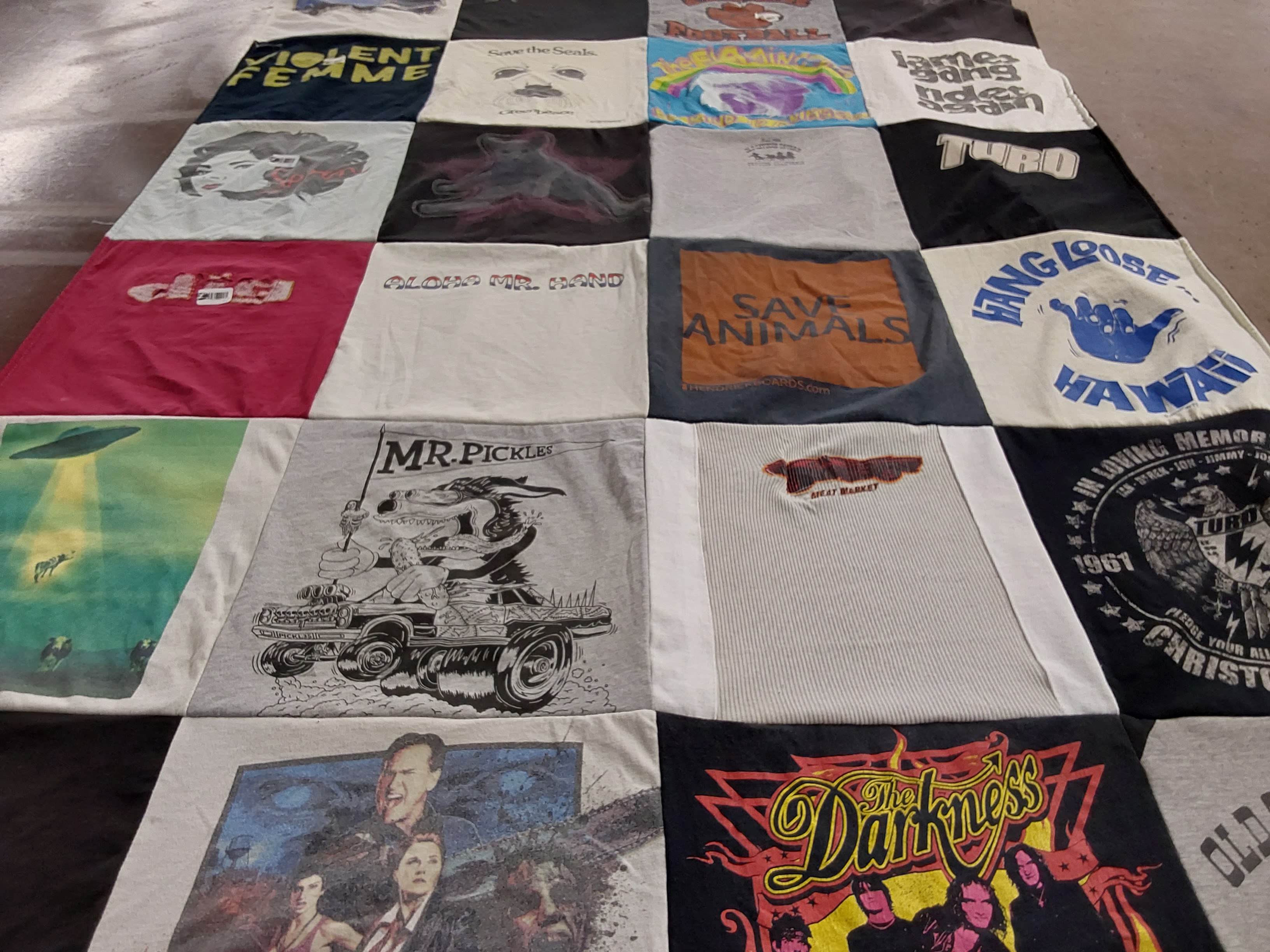 T-shirt quilt with music, animal rights themes by Laurie from CA
