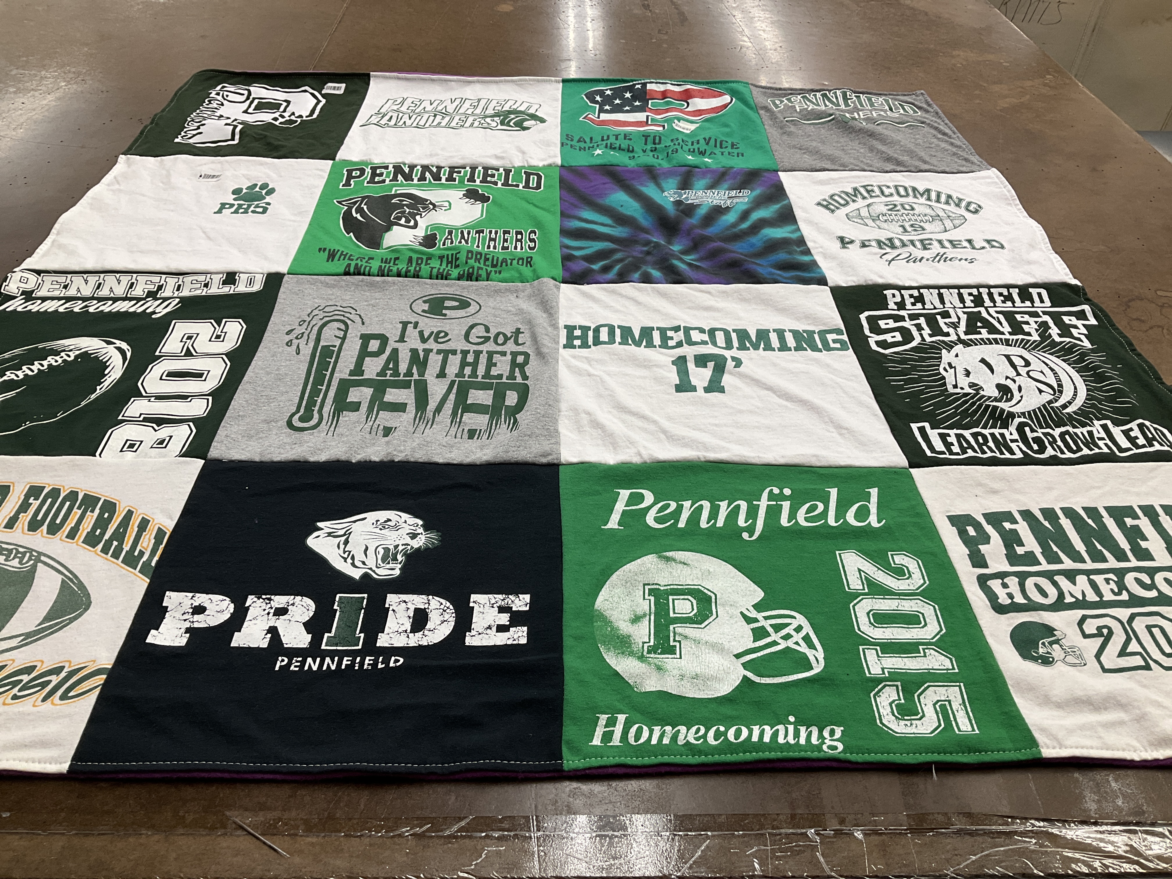 Custom Project Repat t-shirt quilt featuring shirts from pennfield high school.
