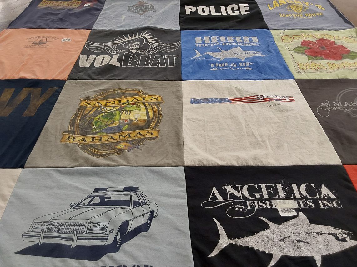 T-shirt quilt with music, travel themes by Rebecca from IL