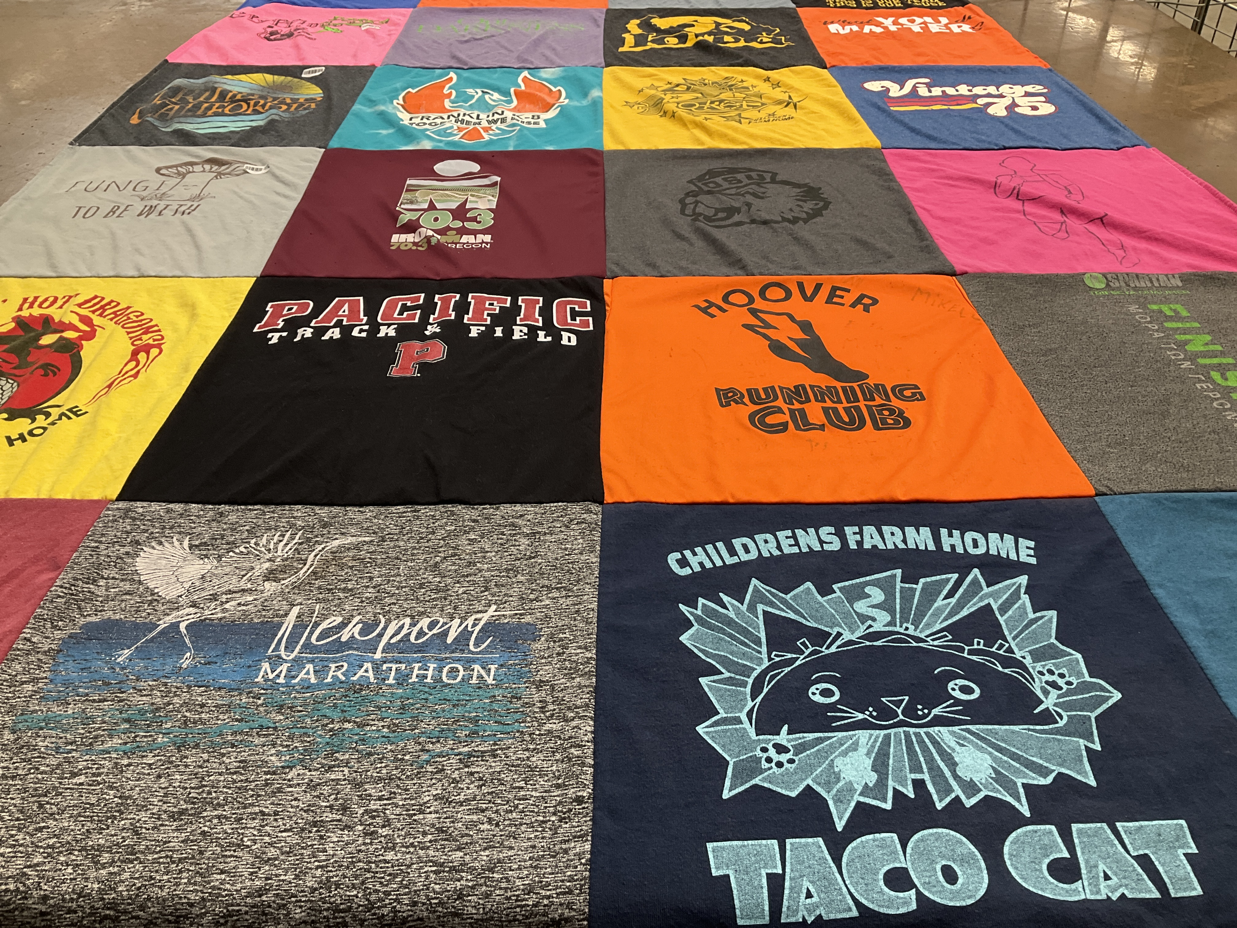 T-shirt quilt featuring hoover running club by Jen from OR
