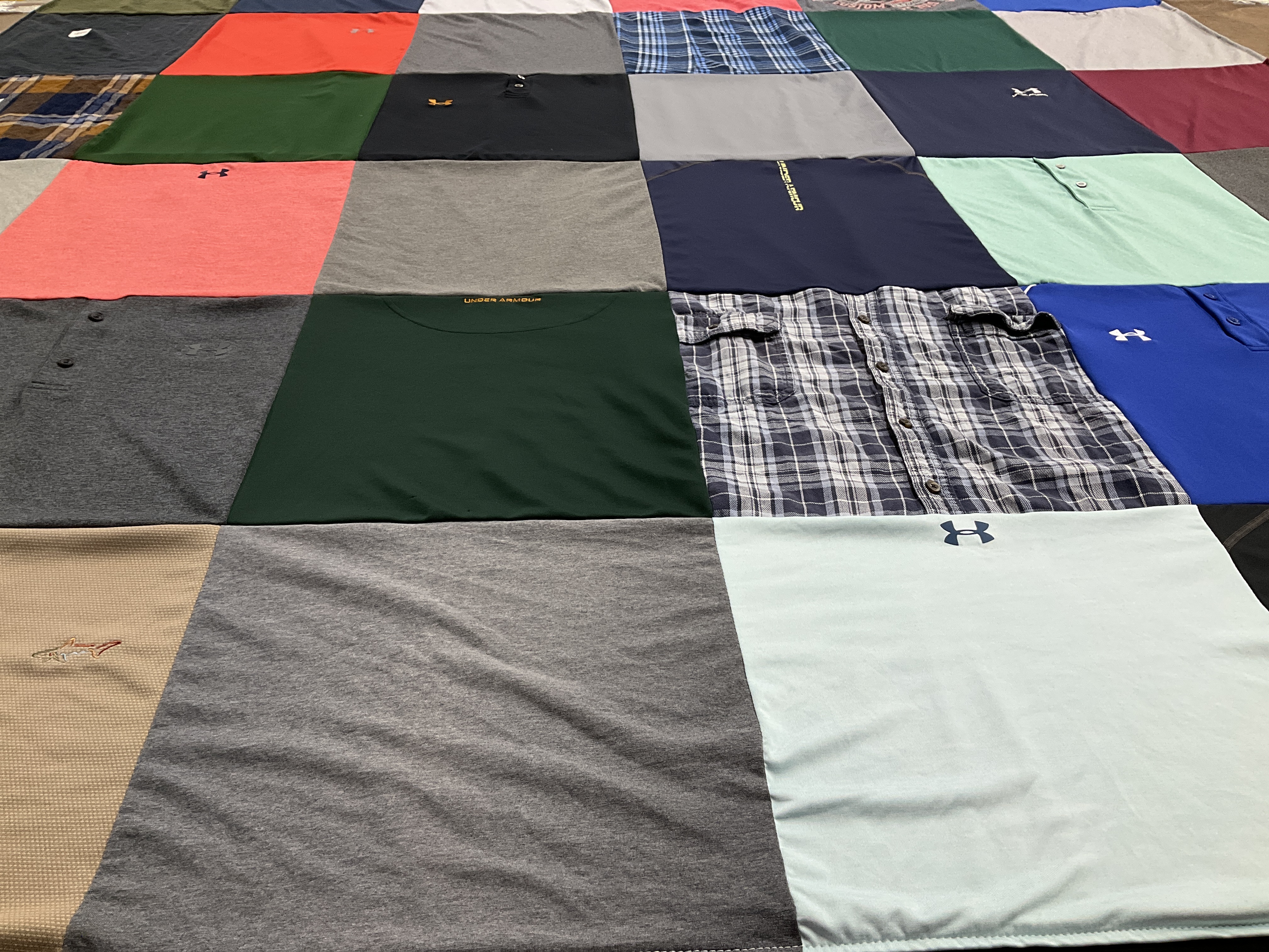 Custom Project Repat t-shirt quilt highlighting fashion, sports themes.