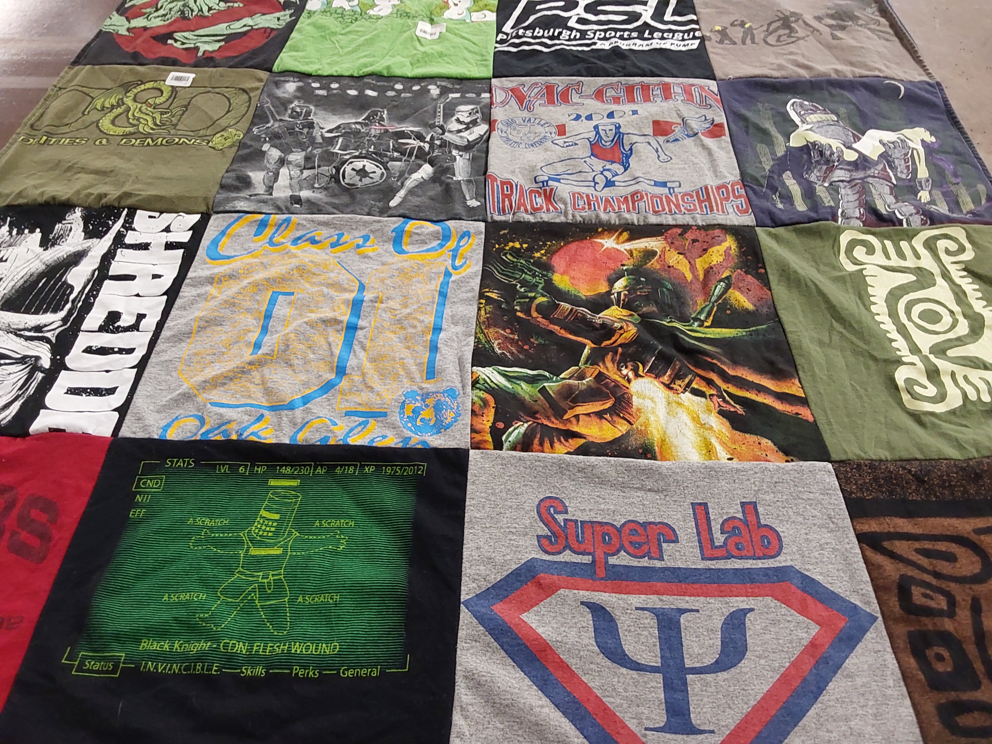 Custom Project Repat t-shirt quilt featuring shirts from oak cliff high school.