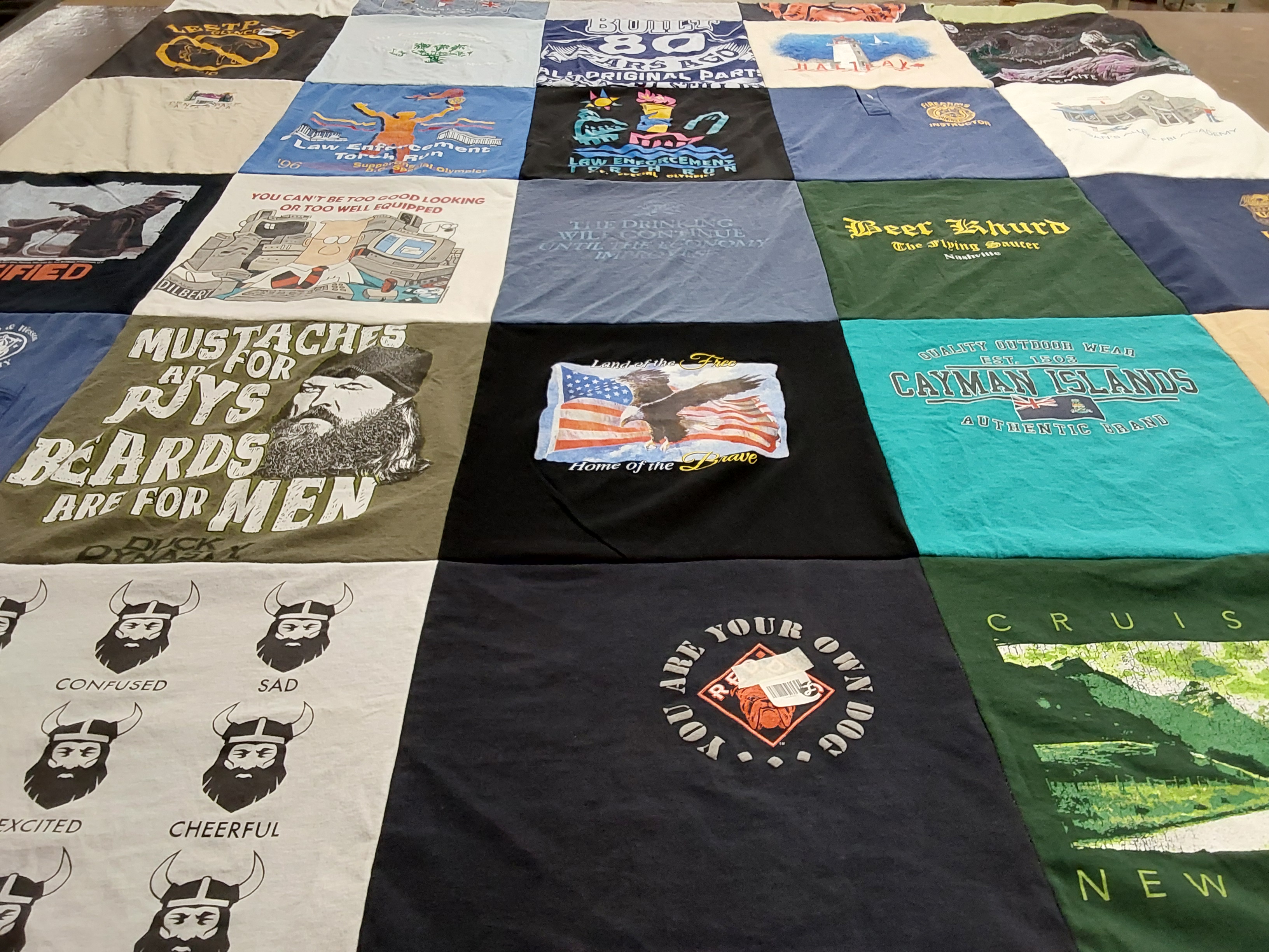 T-shirt quilt with fishing, travel themes by Susann from NC