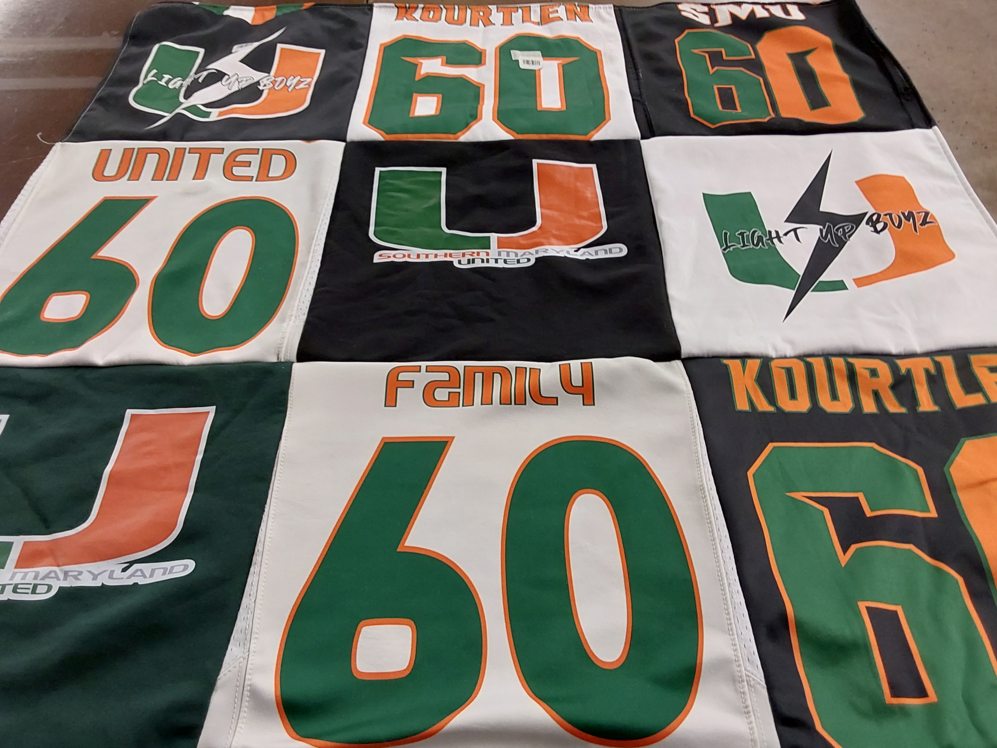 T-shirt quilt with sports, community themes by Shannon from MD
