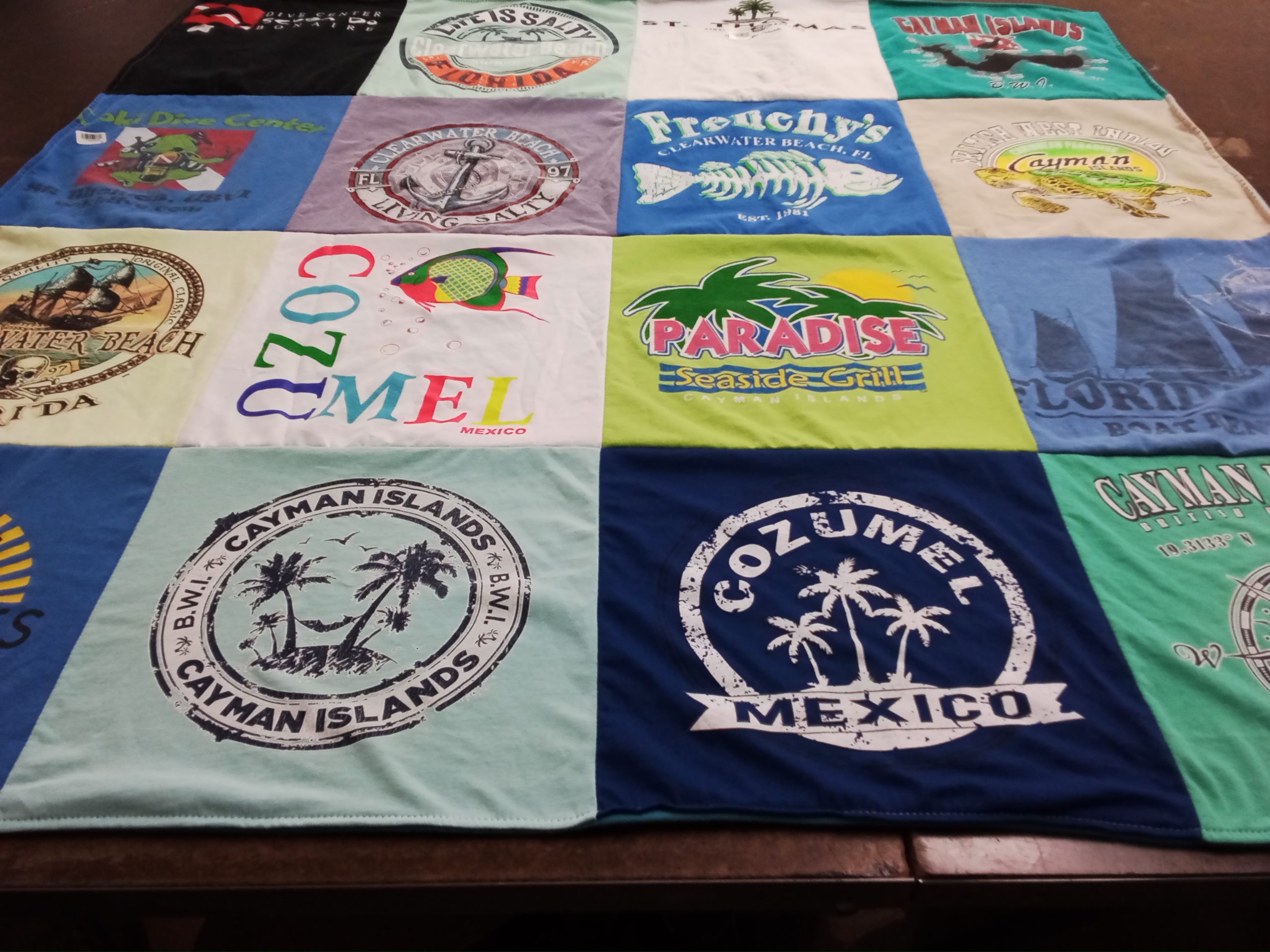 T-shirt quilt with beach, travel themes by Dana from MI