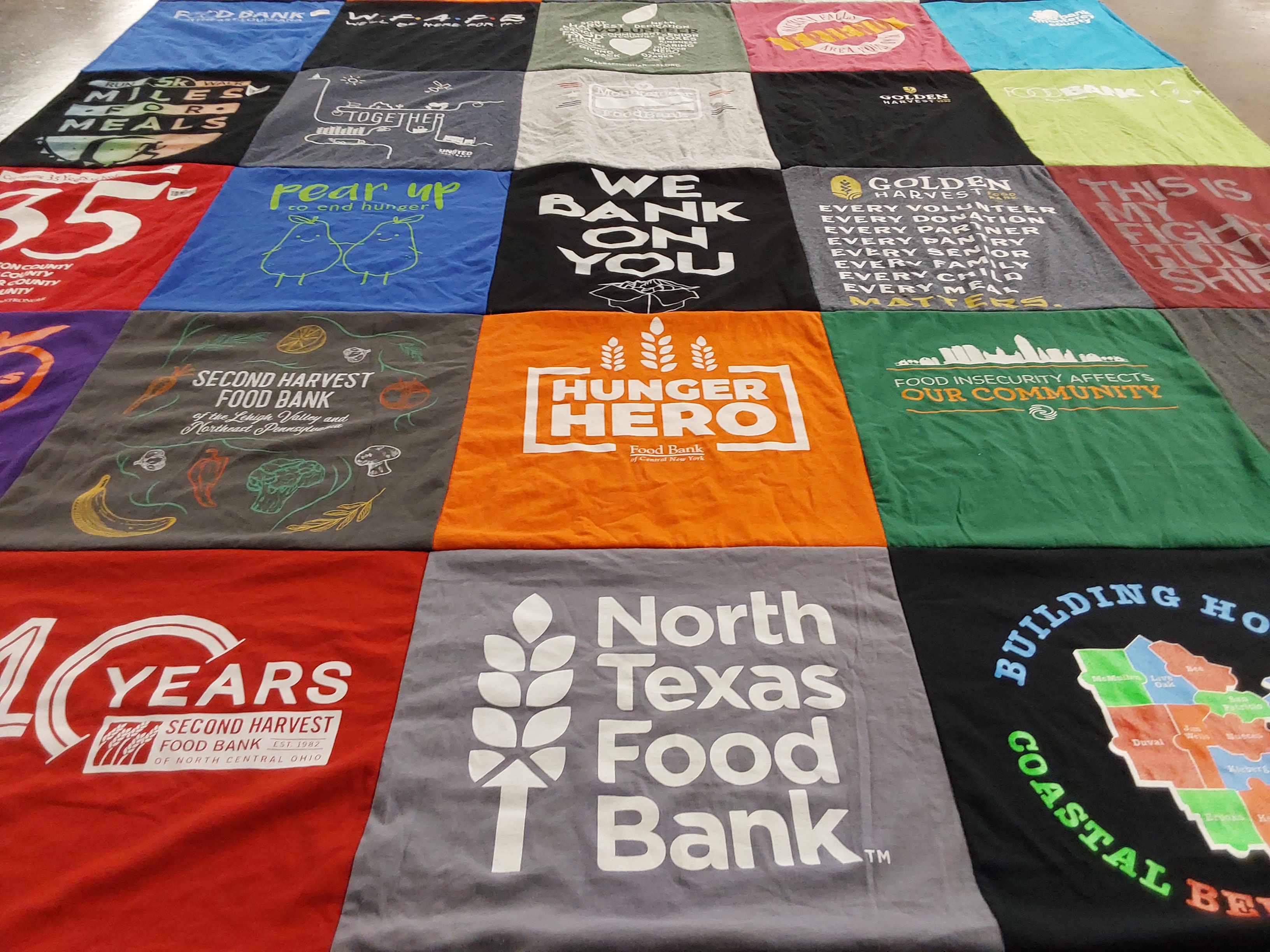 T-shirt quilt with food insecurity, volunteering themes by Tara from IL