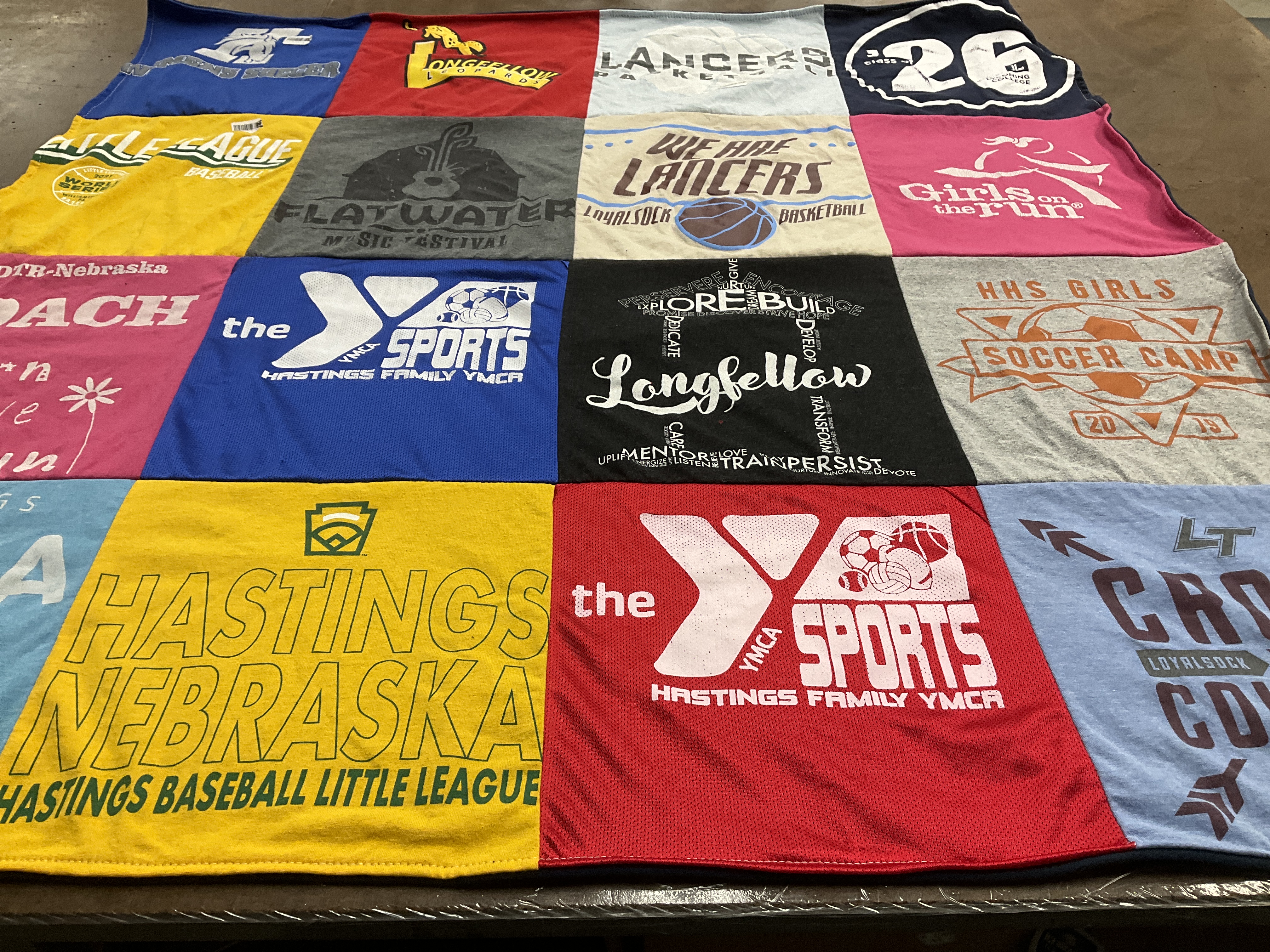 T-shirt quilt featuring hastings high school lancers, hastings family ymca sports by Lorna from PA
