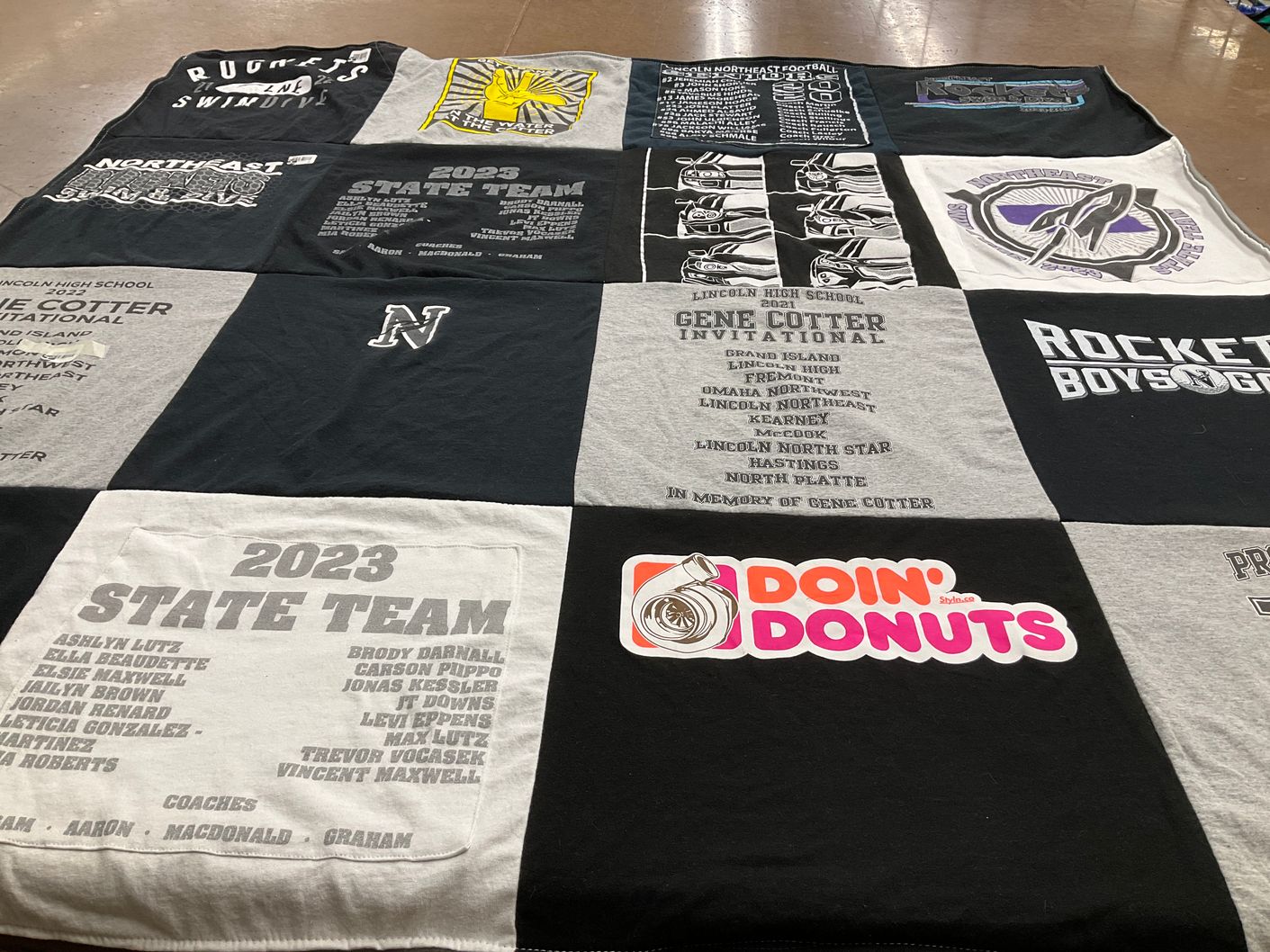 T-shirt quilt featuring lincoln northeast high school football, rockets swim team by Roxanne from NE