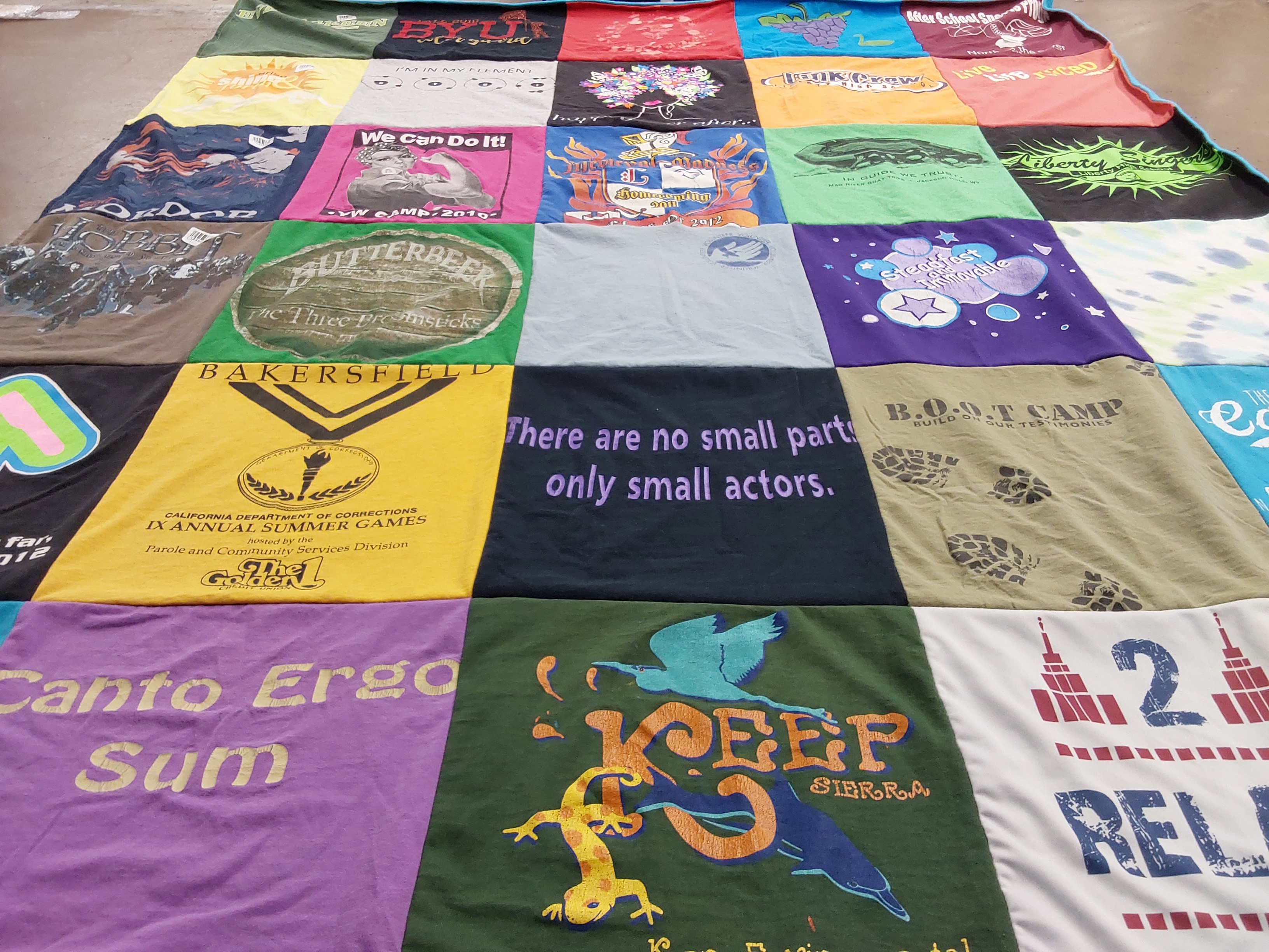 T-shirt quilt with camping, theater themes by Michelle from UT