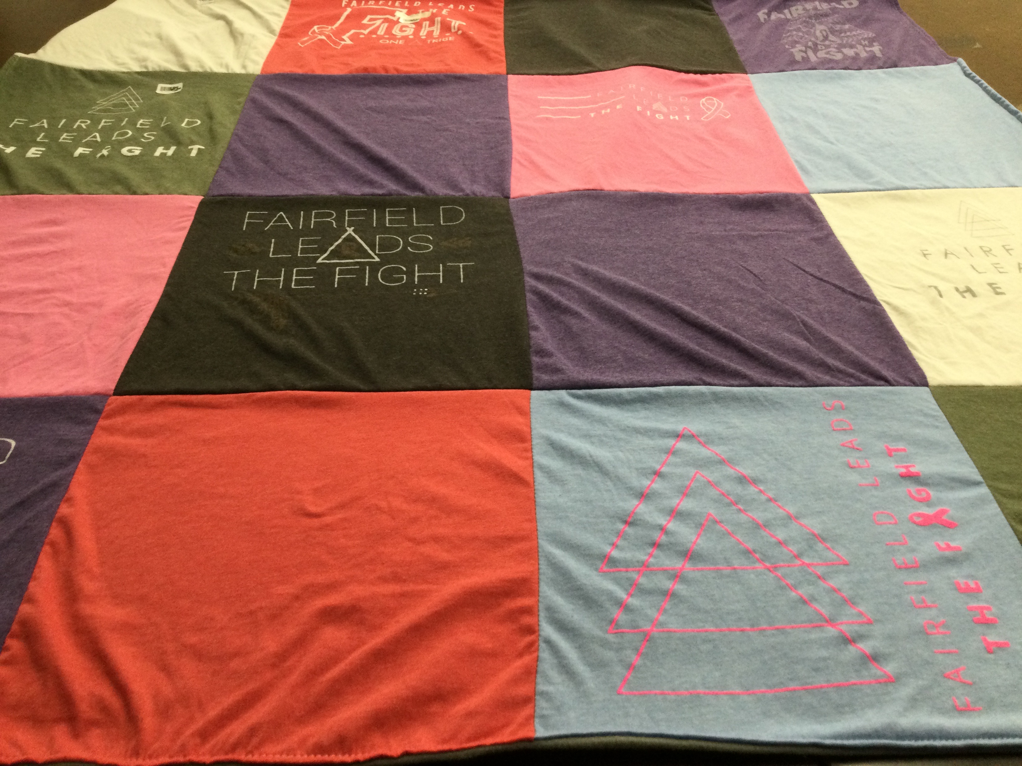 T-shirt quilt with community support, health awareness themes by Erica from OH