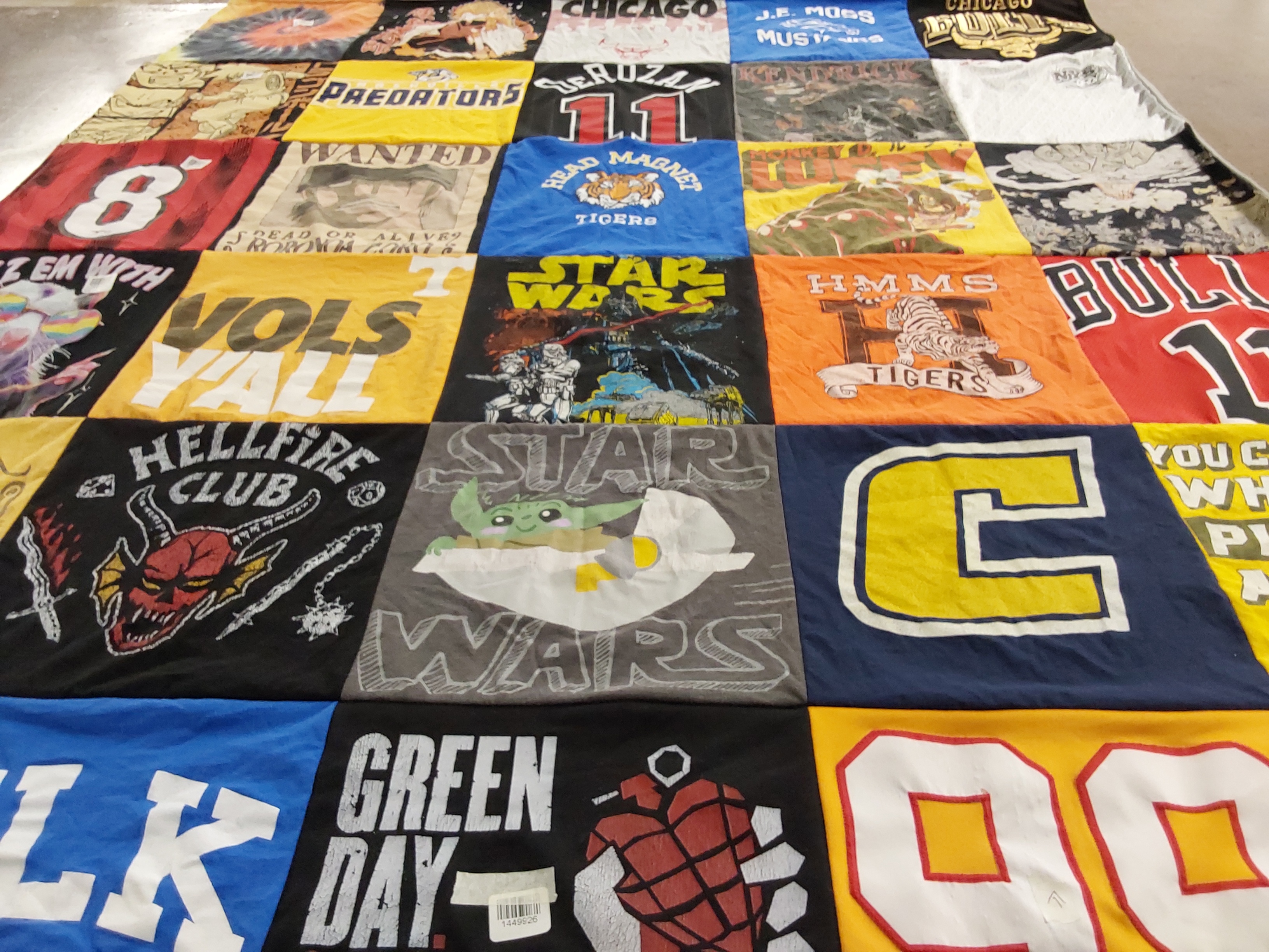 T-shirt quilt with sports, music themes by Holly from TN