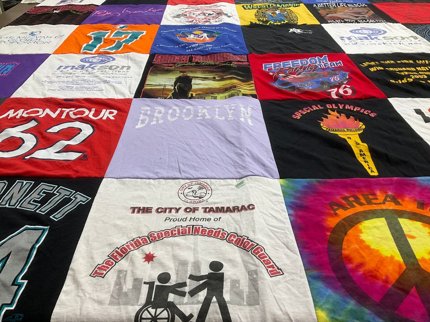 T-shirt quilt with sports, community themes by Barrie from FL