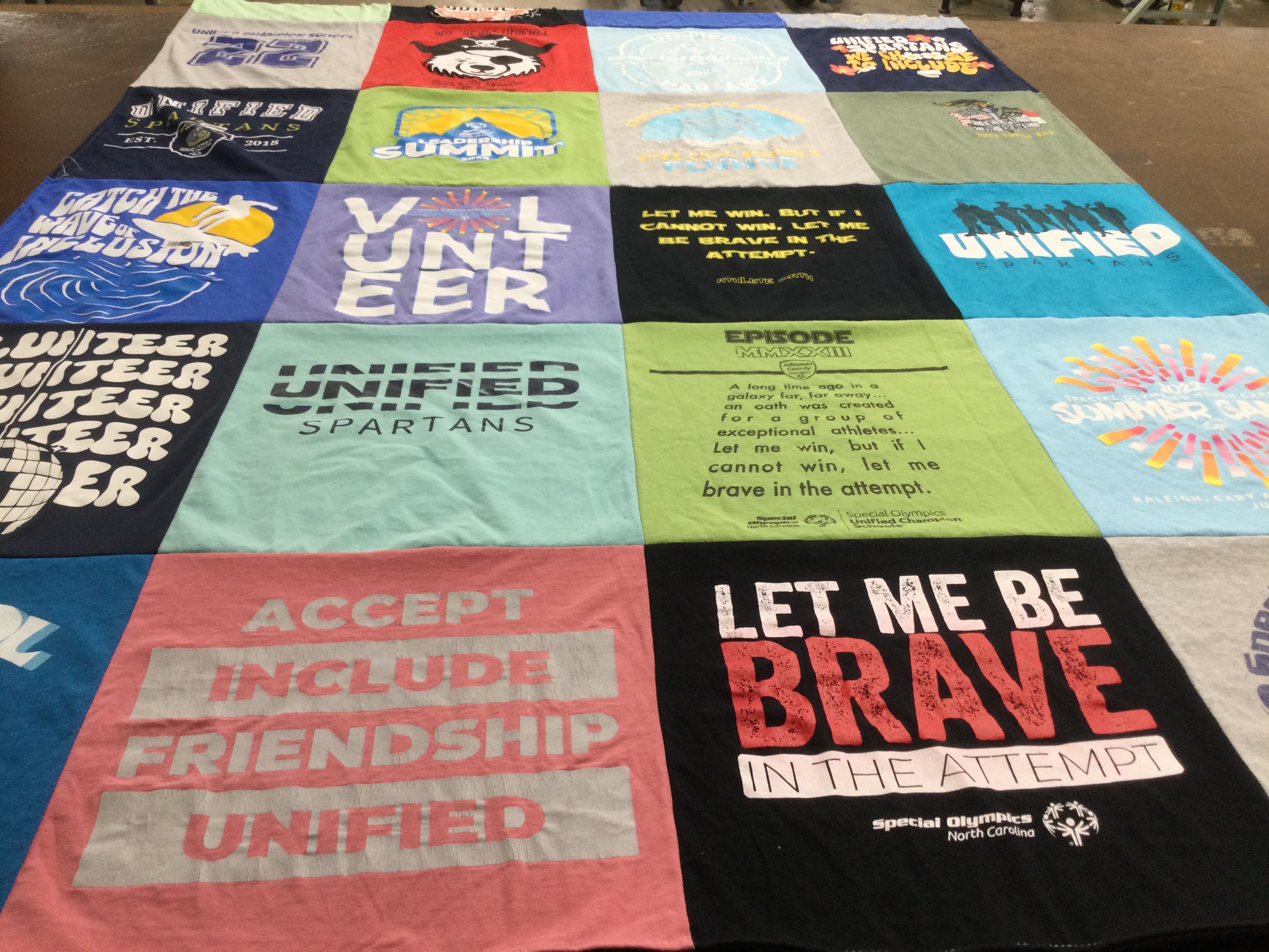 T-shirt quilt with volunteering, sports themes by Katie from NC