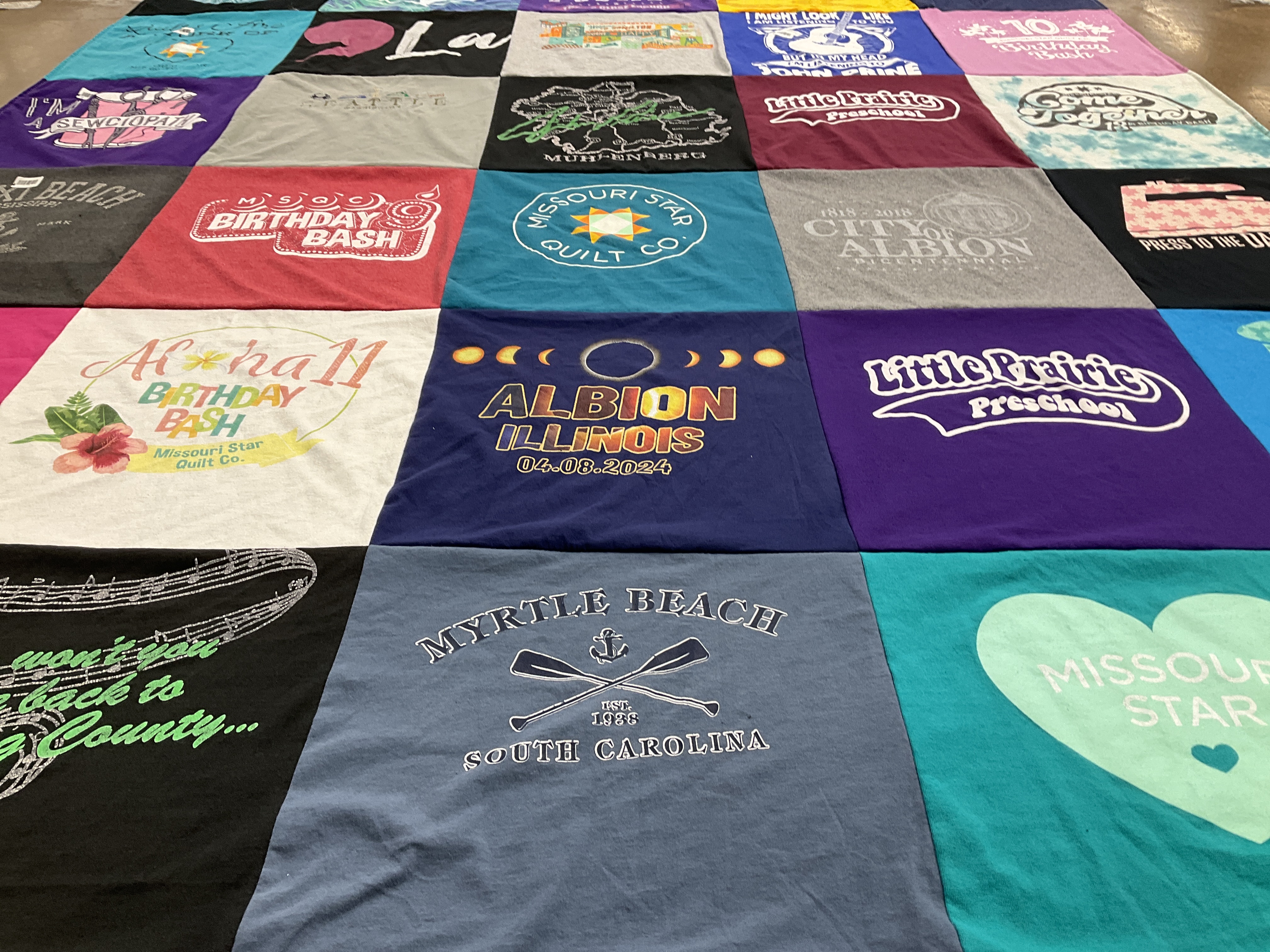 T-shirt quilt with quilting, celebrations themes by Sharon from IL