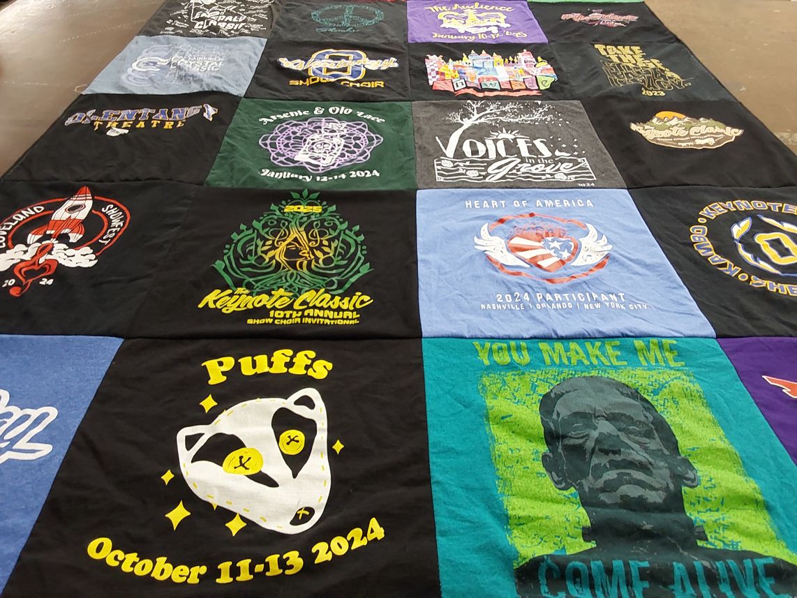 T-shirt quilt with theater, snow choir themes by Megan from OH