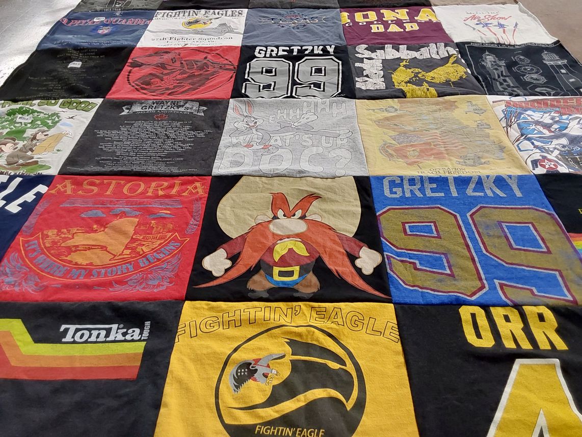T-shirt quilt with hockey, cartoons themes by Stacey from NJ
