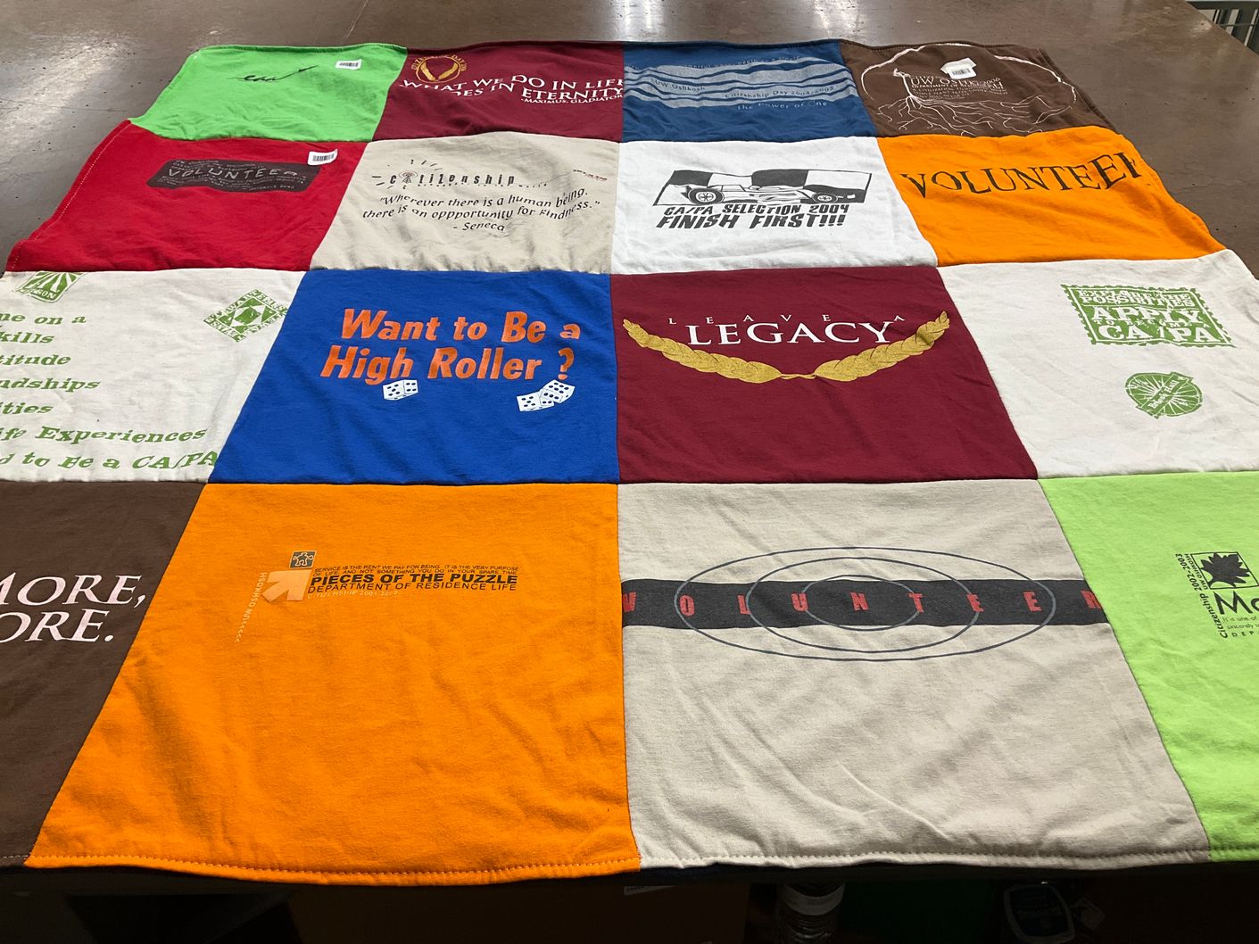 T-shirt quilt with volunteering, games themes by Kristine from CO