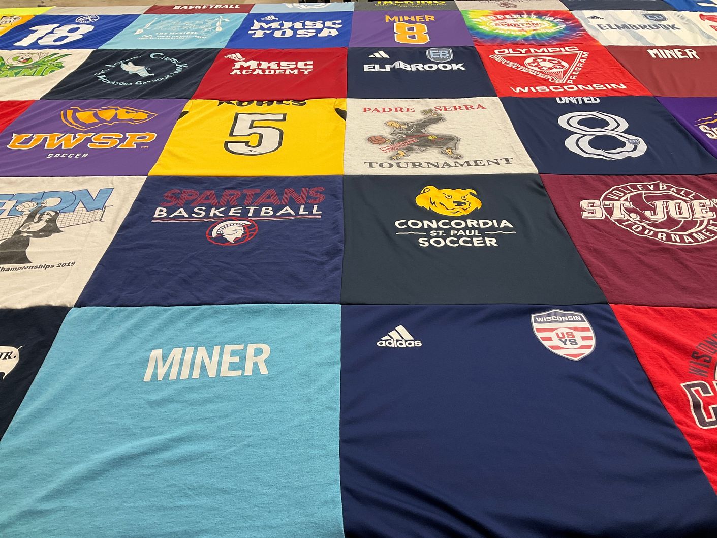 T-shirt quilt featuring spartans basketball, miner's soccer by Kathleen from WI