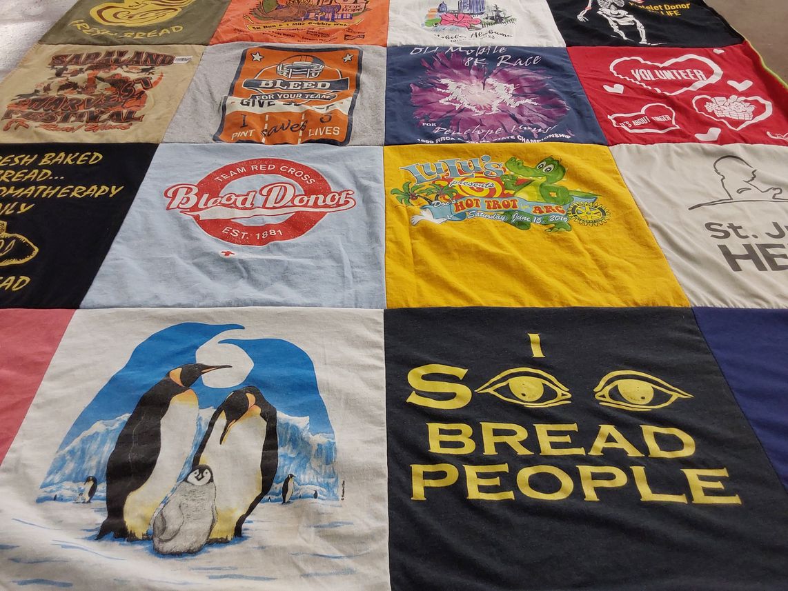T-shirt quilt with volunteering, donating themes by Carol from AZ