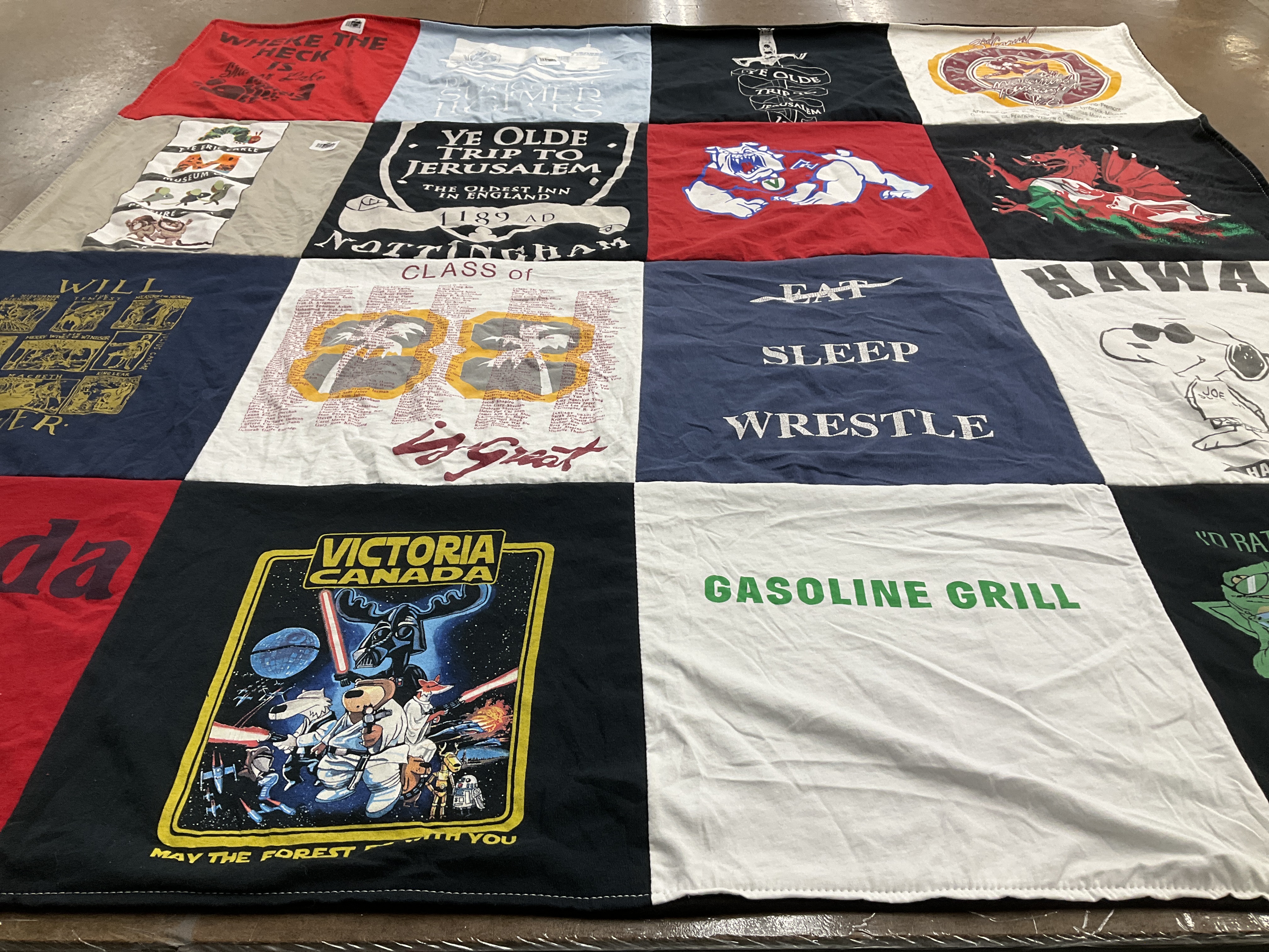 T-shirt quilt with wrestling, travel themes by Sean from CA