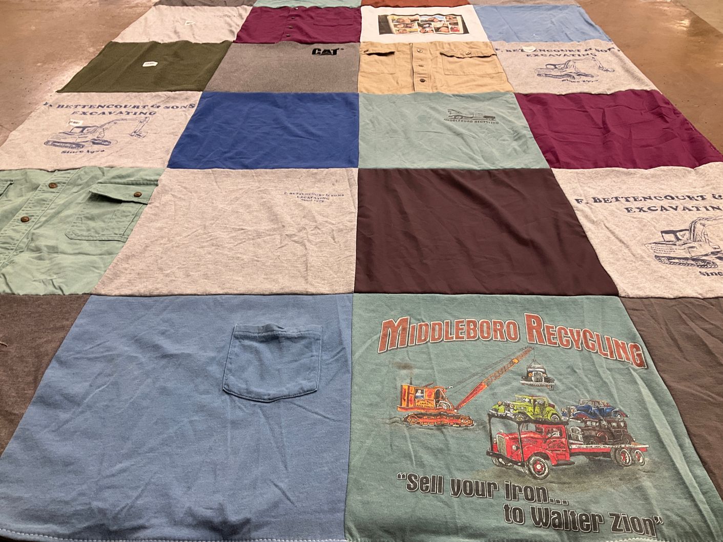 T-shirt quilt with construction, recycling themes by Linda from MA