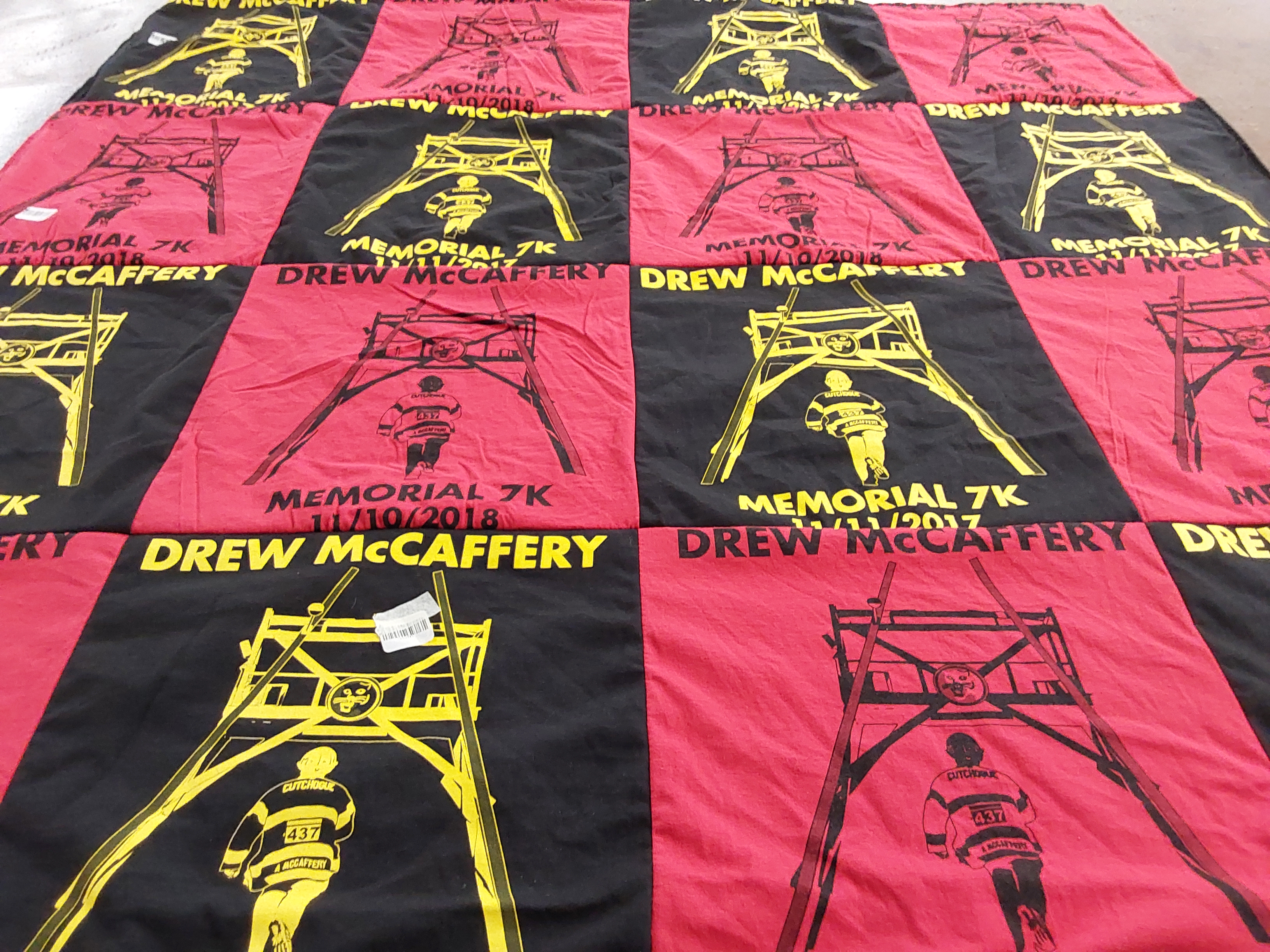 T-shirt quilt with running, memorial events themes by Lynn from NY