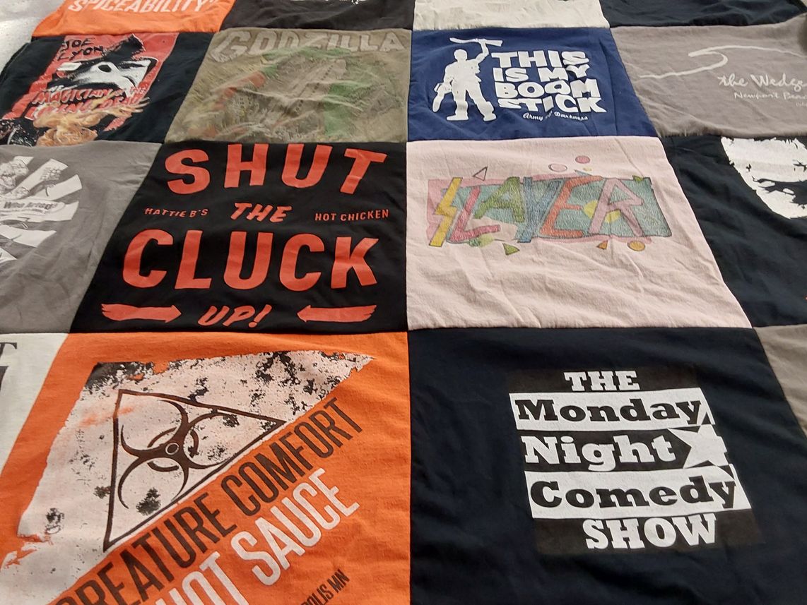 T-shirt quilt with comedy, music themes by Andrea from MN