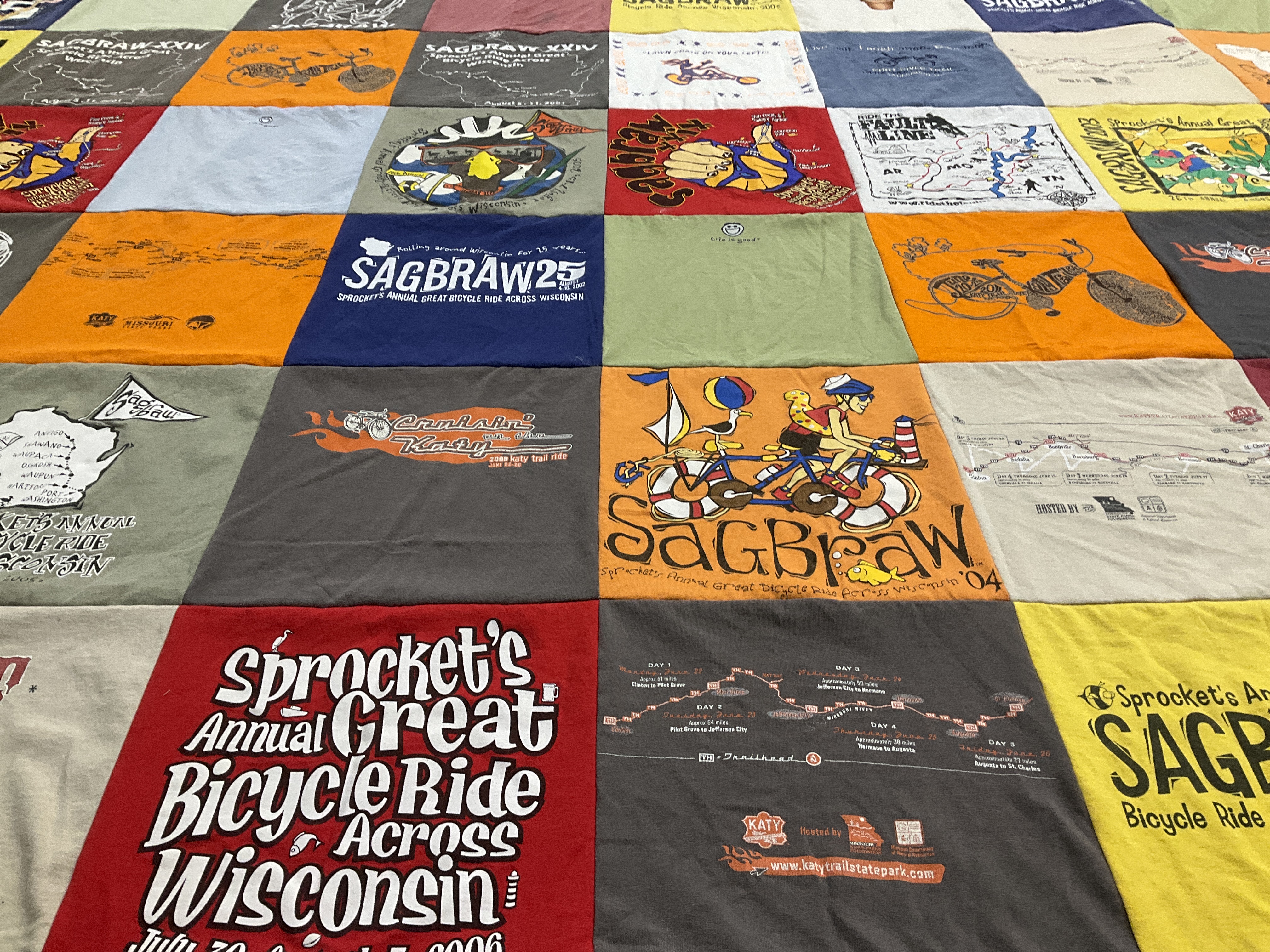 T-shirt quilt with cycling, bicycle rides themes by Robin from AZ