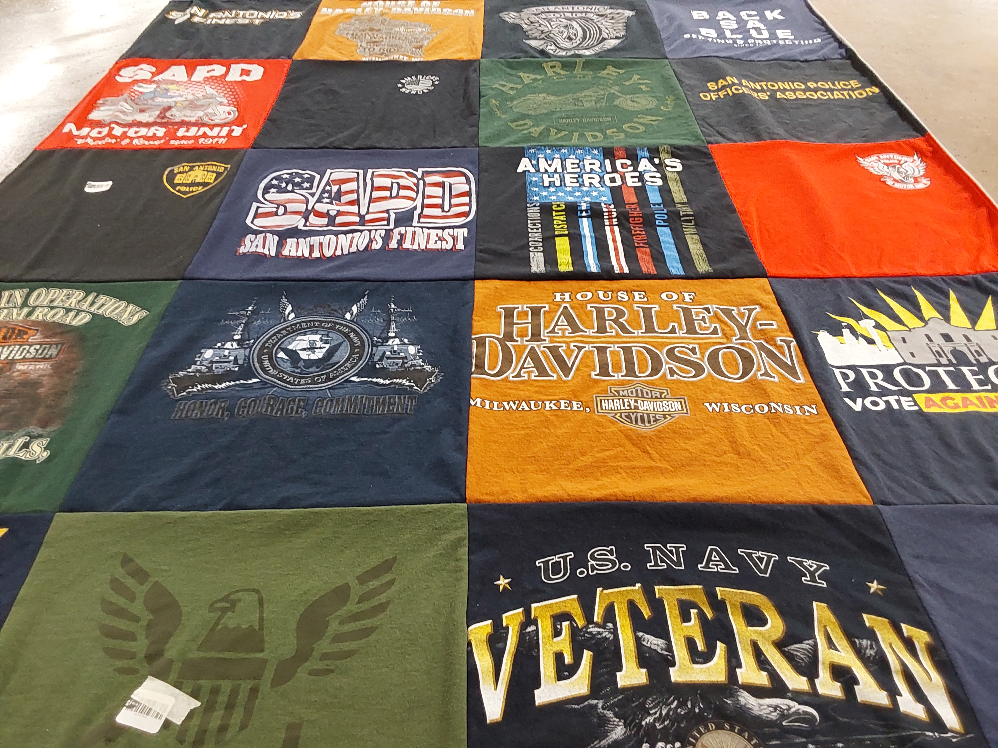 T-shirt quilt with law enforcement, motorcycling themes by Dennis from TX