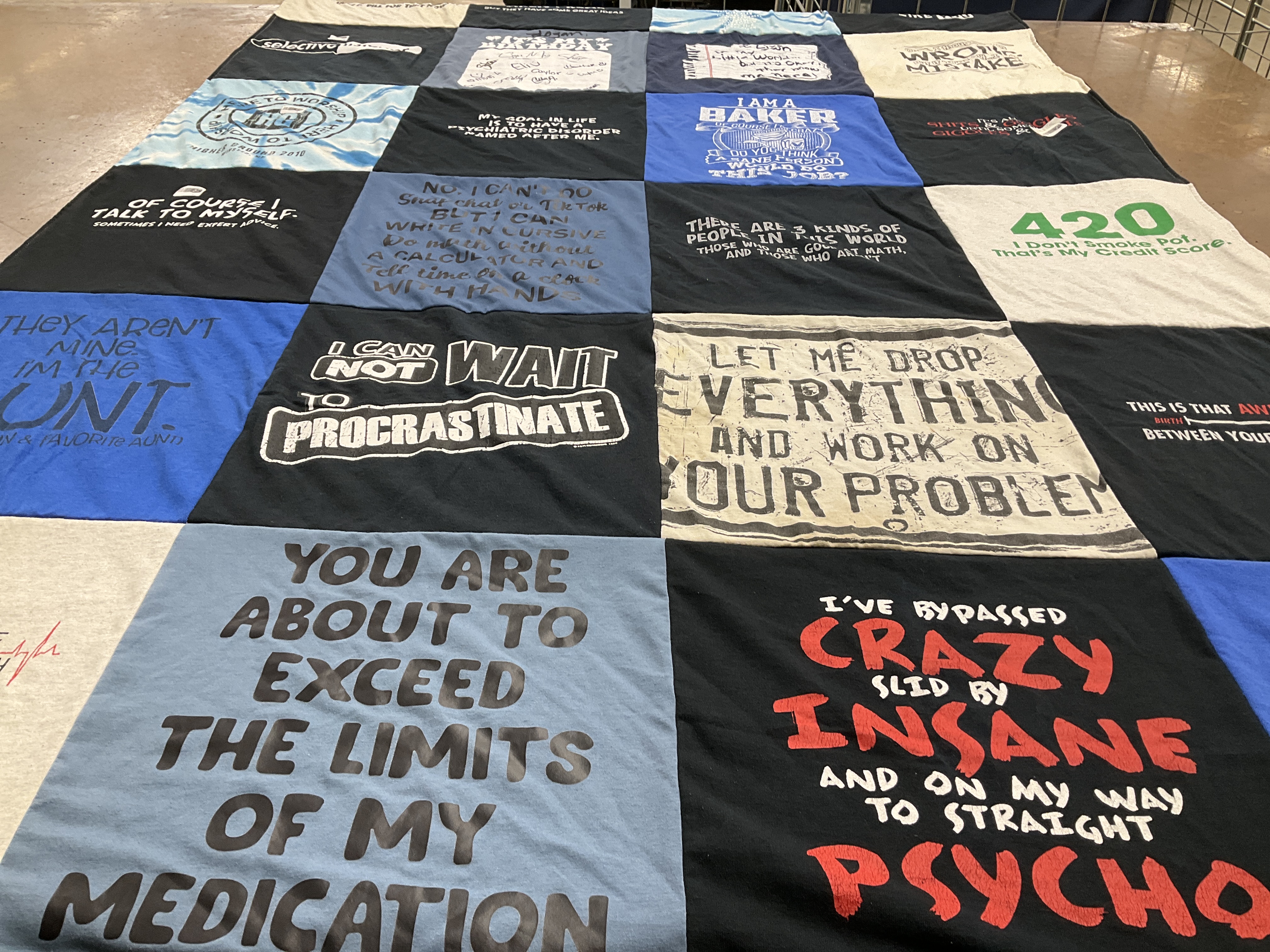 T-shirt quilt with baking, mental health themes by Marnie from MN