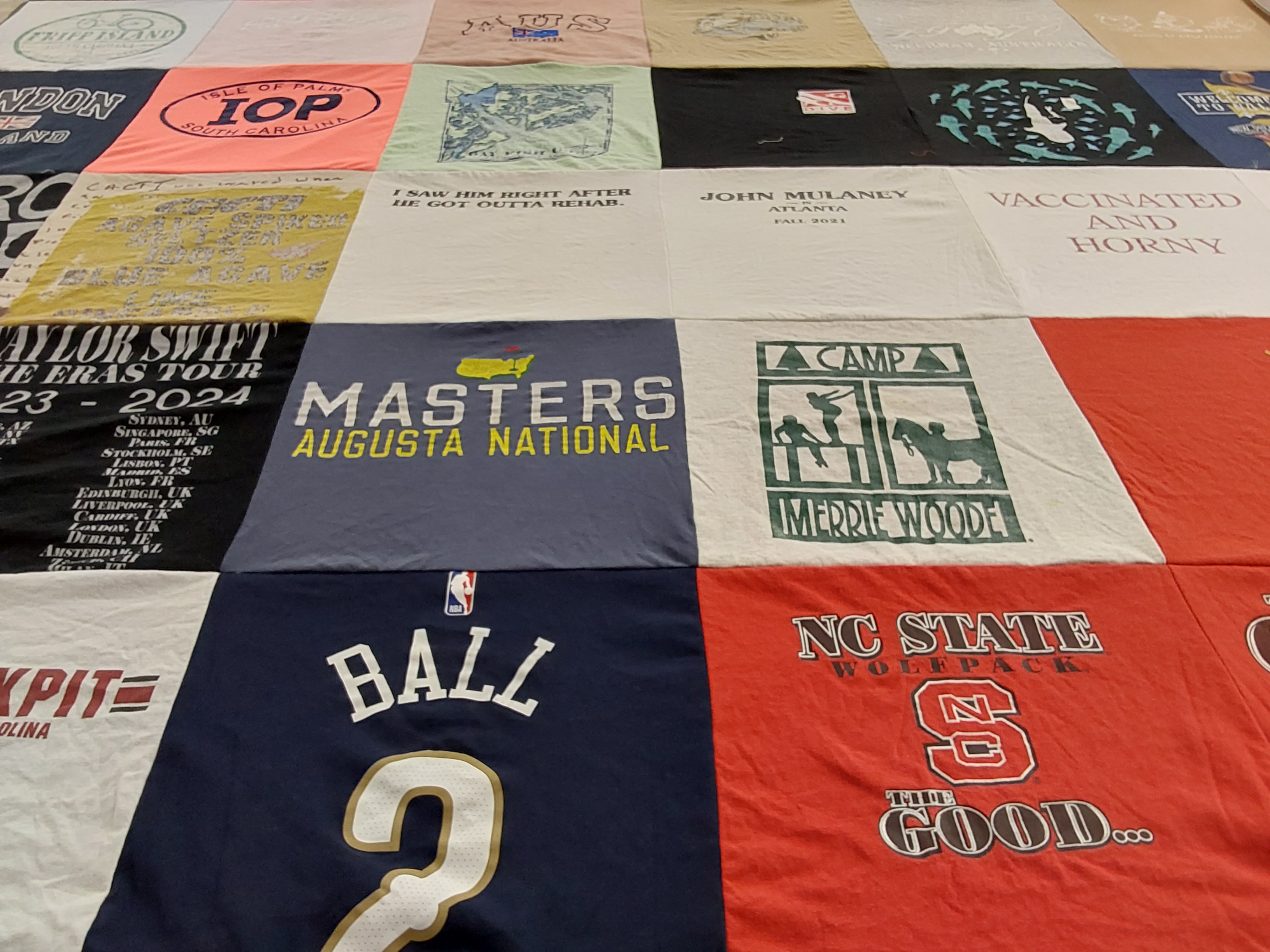 Custom Project Repat t-shirt quilt featuring shirts from north carolina state university.