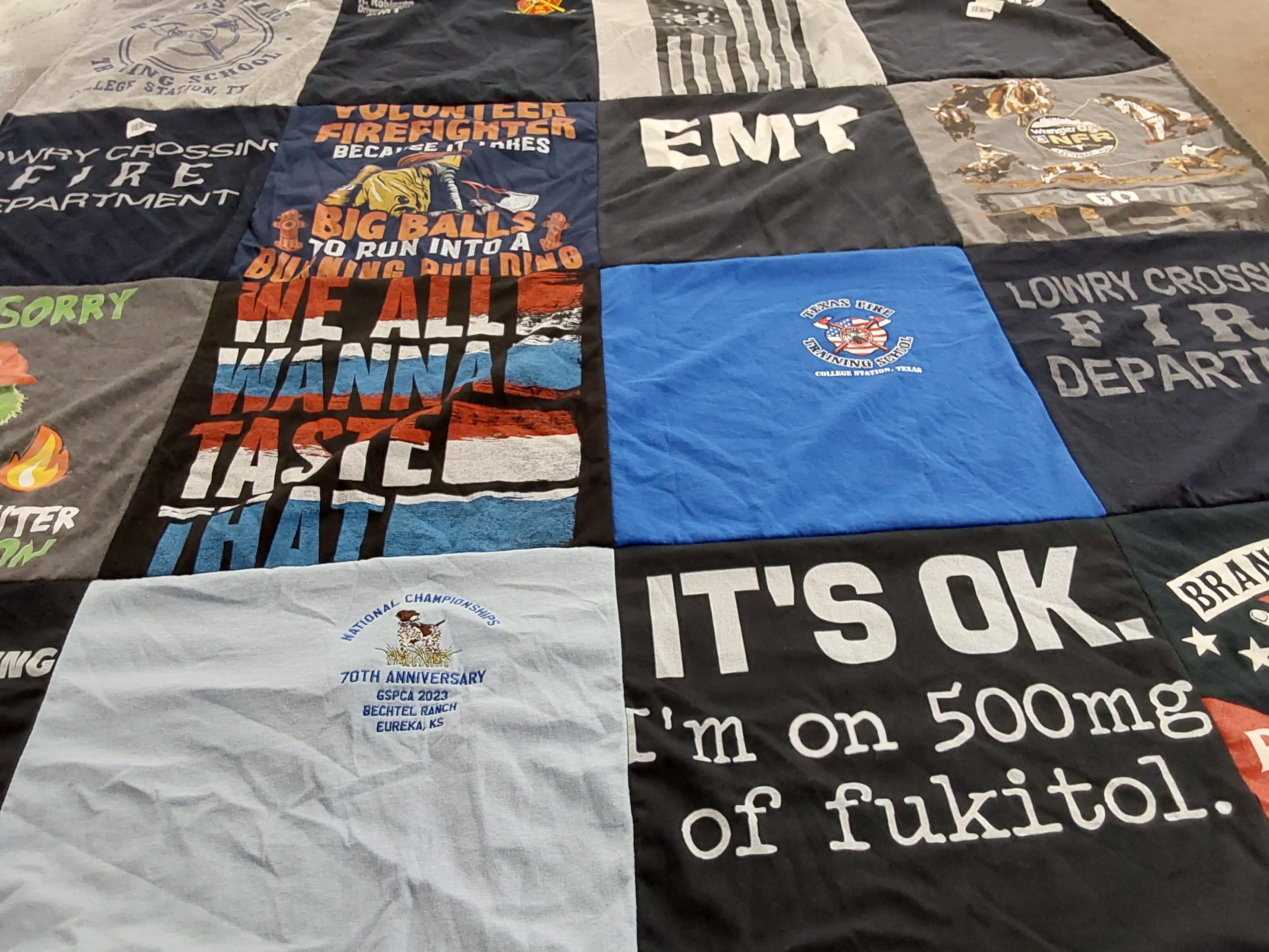 T-shirt quilt with firefighting, emergency medical services themes by Kerri from TX