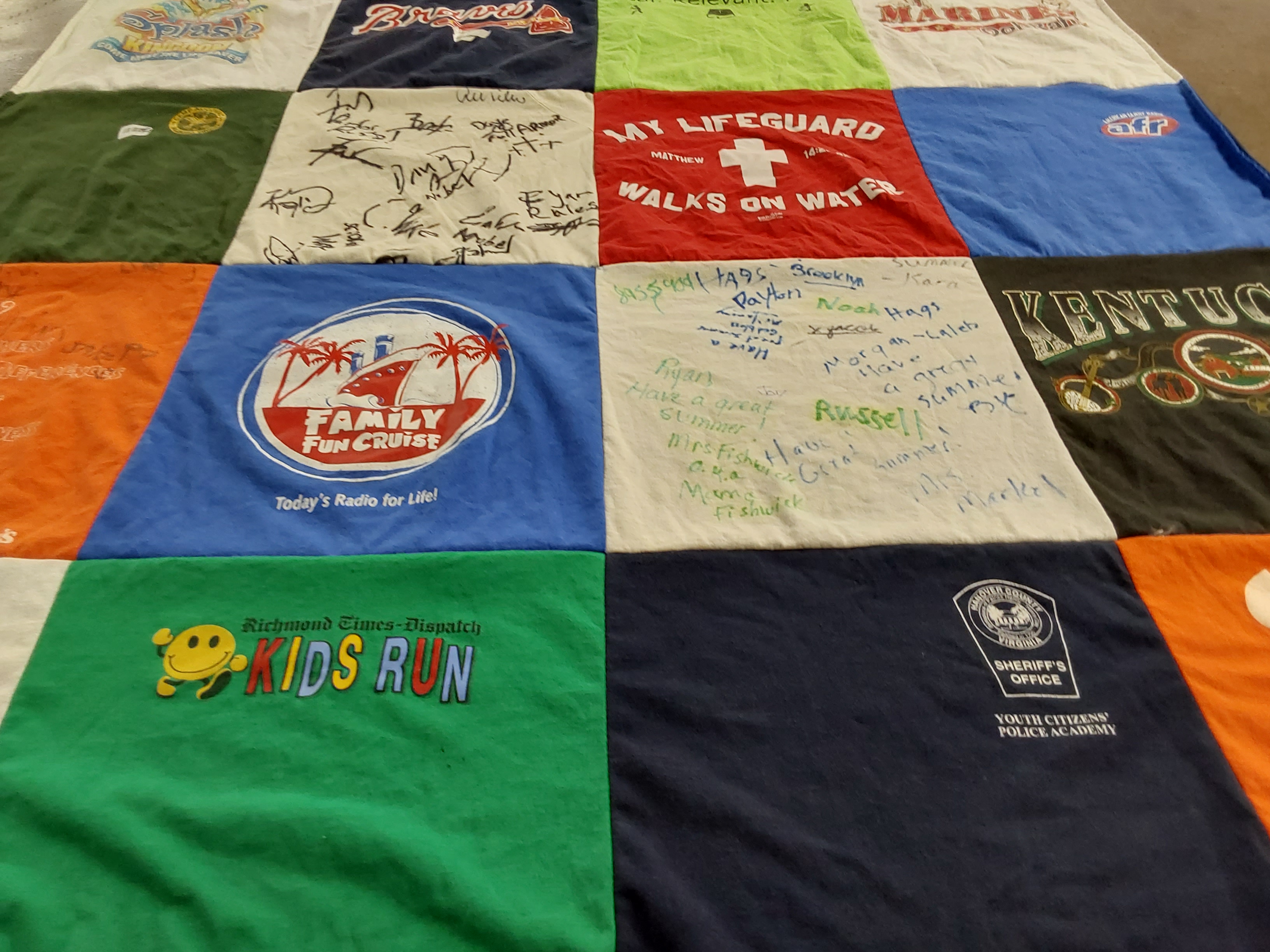 T-shirt quilt with sports, community events themes by Nancy from VA
