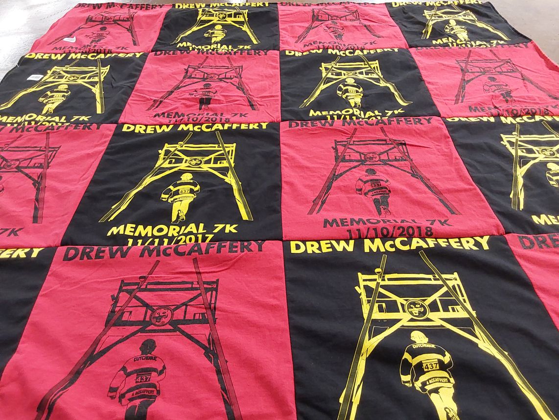 T-shirt quilt with running, memorial events themes by Lynn from NY
