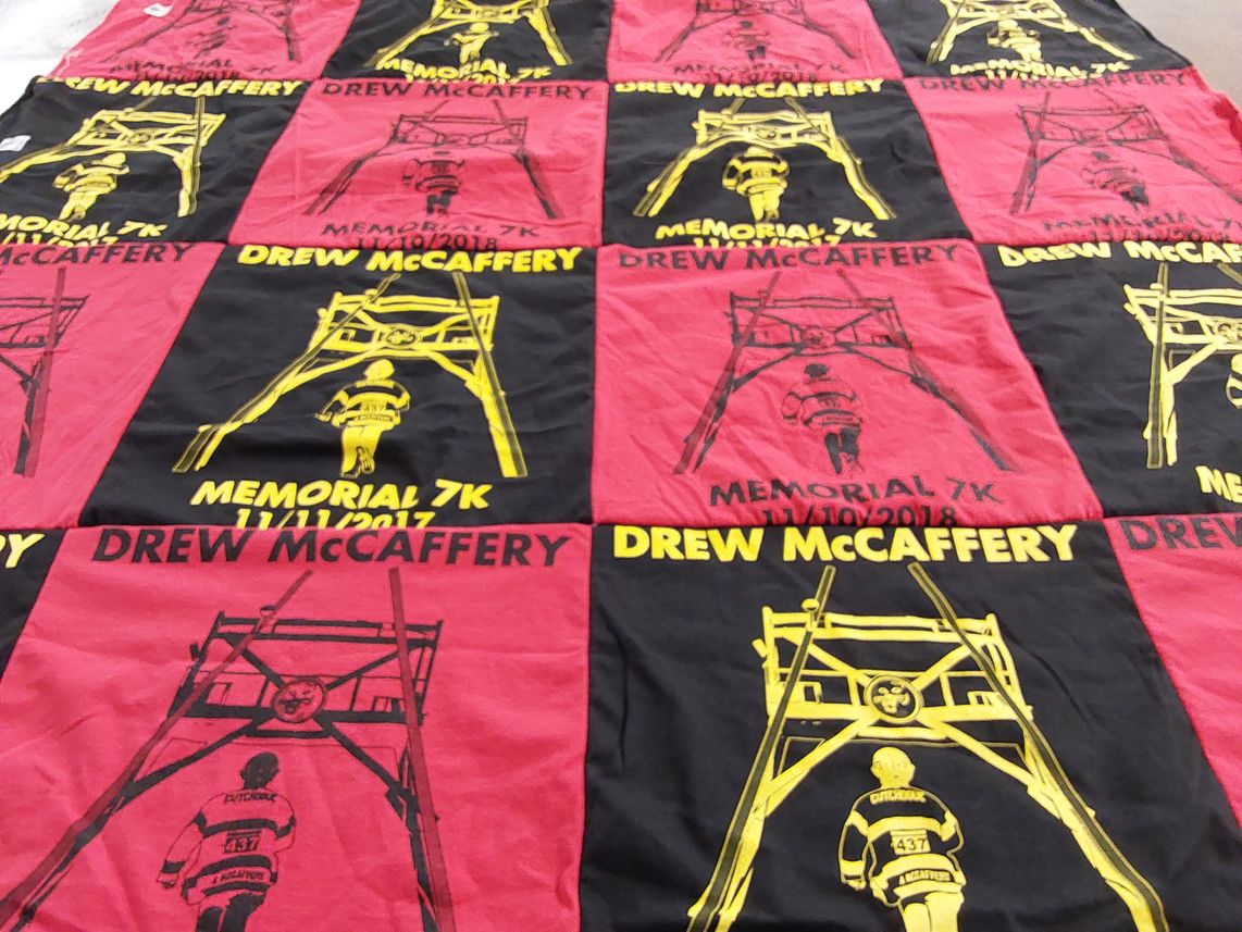 T-shirt quilt with running, memorial events themes by Lynn from NY