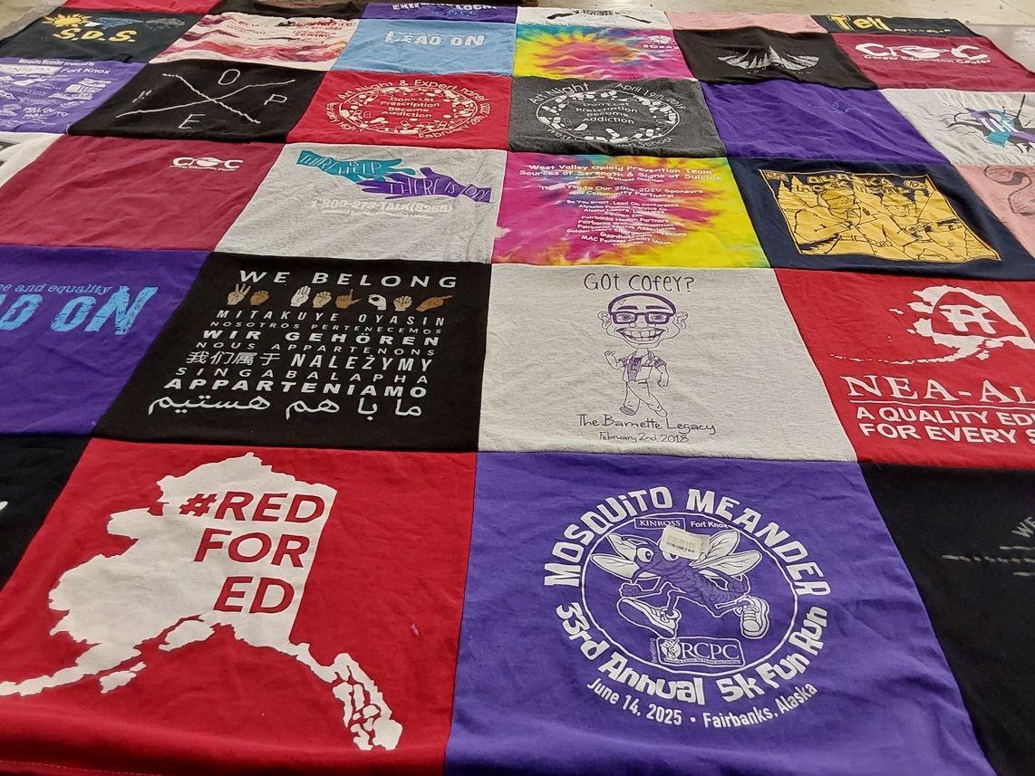 T-shirt quilt with community, equality themes by Joy from AK