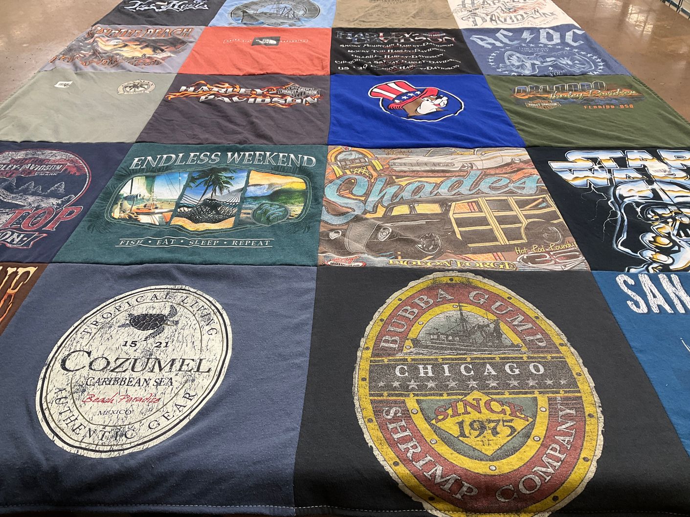 T-shirt quilt with fishing, travel themes by Brandy from NC