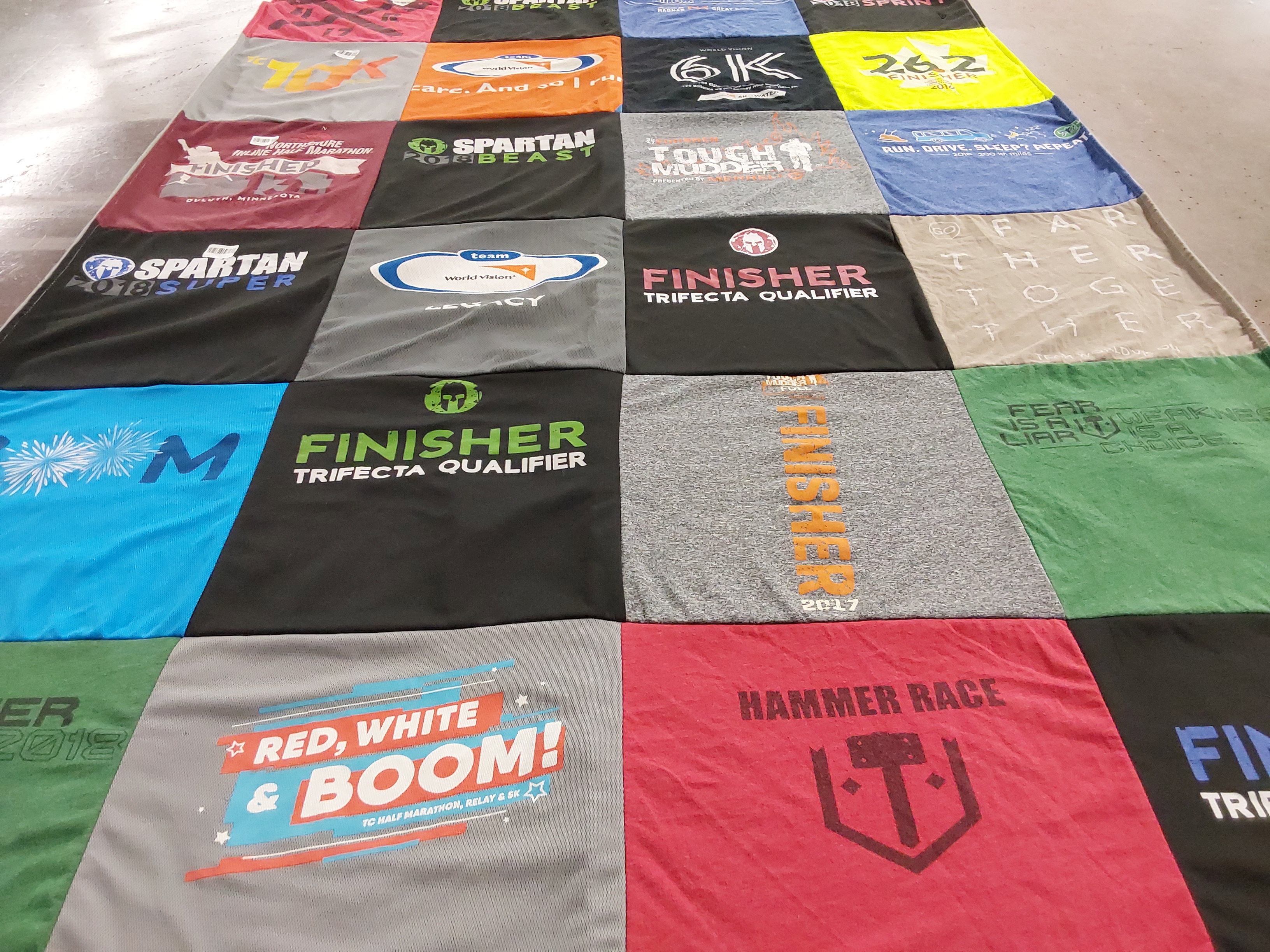 T-shirt quilt with obstacle racing, fitness themes by Karee from MN