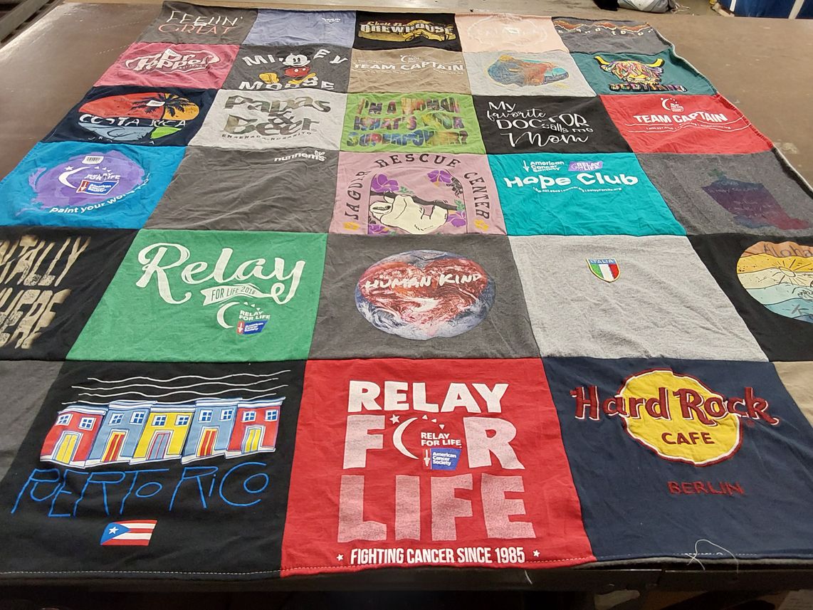 T-shirt quilt with cancer awareness, community service themes by Virginia from CA