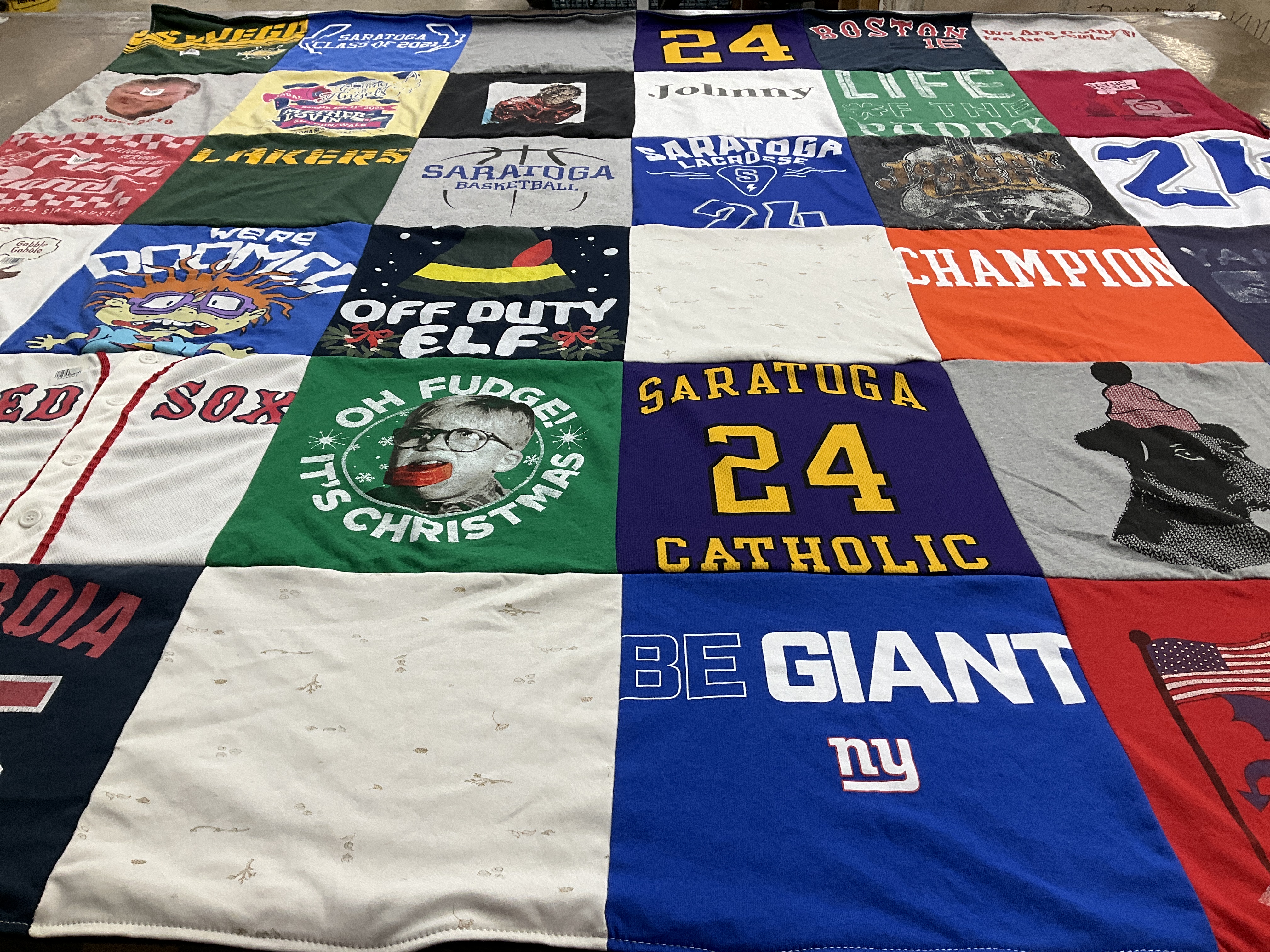 Custom Project Repat t-shirt quilt featuring shirts from saratoga catholic high school.